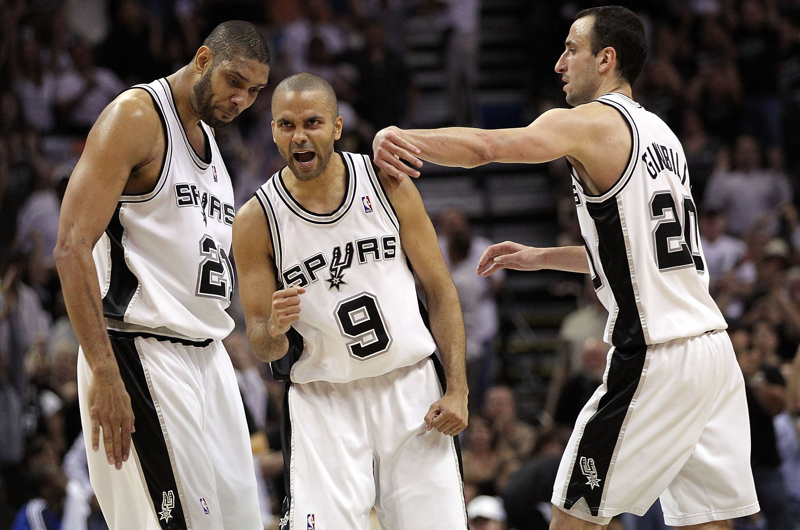 SAN ANTONIO - APRIL 23: Tony Parker #9 of the San Antonio Spurs reacts with Tim Duncan #21 and Manu Ginobili #20 against the Dallas Mavericks in Game Three of the Western Conference Quarterfinals during the 2010 NBA Playoffs at AT&T Center on April 23, 20 SAN ANTONIO - APRIL 23: Tony Parker #9 of the San Antonio Spurs reacts with Tim Duncan #21 and Manu Ginobili #20 against the Dallas Mavericks in Game Three of the Western Conference Quarterfinals during the 2010 NBA Playoffs at AT&T Center on April 23, 20