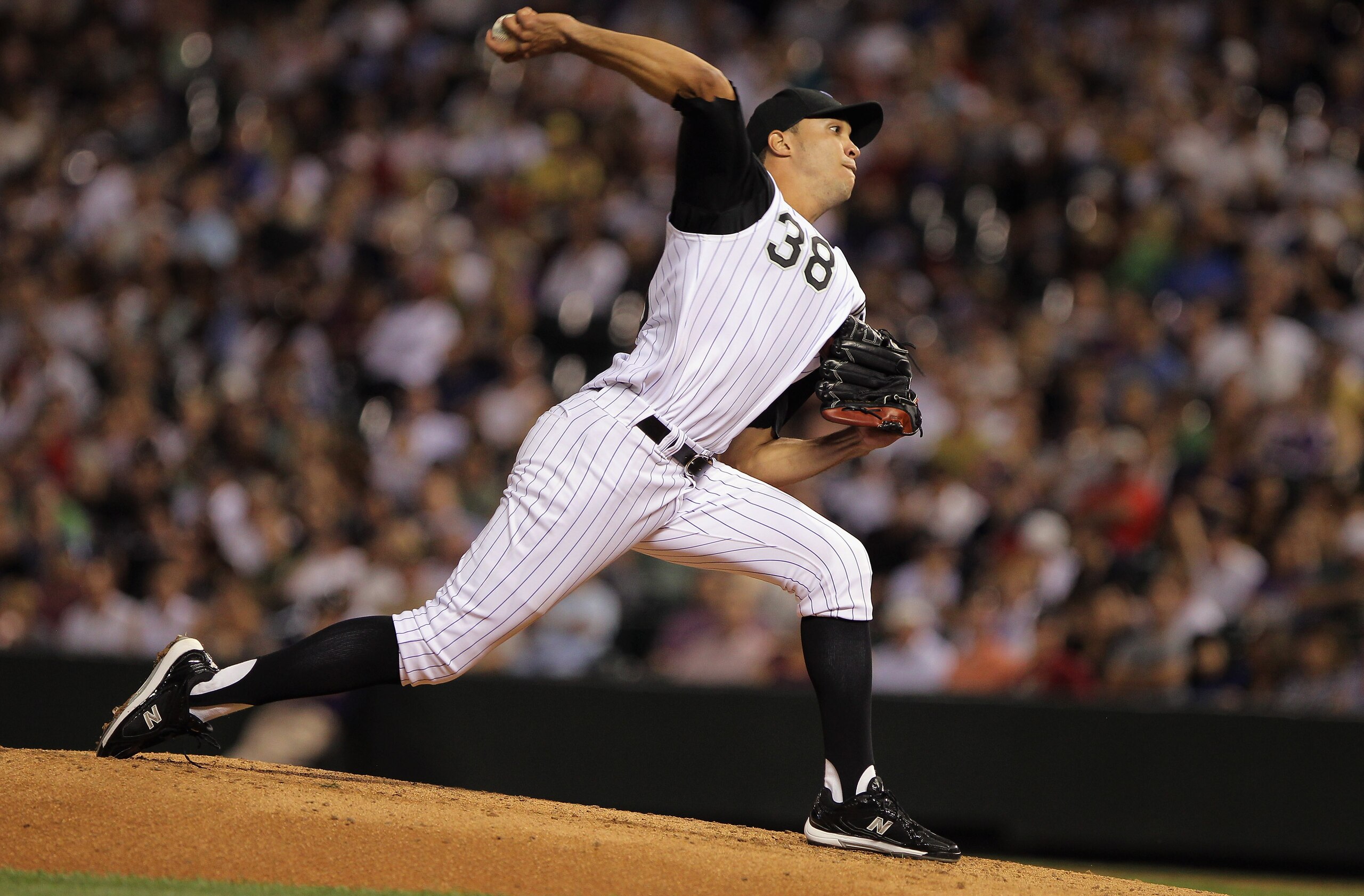 DENVER - SEPTEMBER 27: Starting pitcher Ubaldo Jimenez #38 of the Colorado Rockies works against the Los Angeles Dodgers at Coors Field on September 25, 2010 in Denver, Colorado. Jiimenez failed to earn his 20th win of the season as the Dodgers defeated DENVER - SEPTEMBER 27: Starting pitcher Ubaldo Jimenez #38 of the Colorado Rockies works against the Los Angeles Dodgers at Coors Field on September 25, 2010 in Denver, Colorado. Jiimenez failed to earn his 20th win of the season as the Dodgers defeated