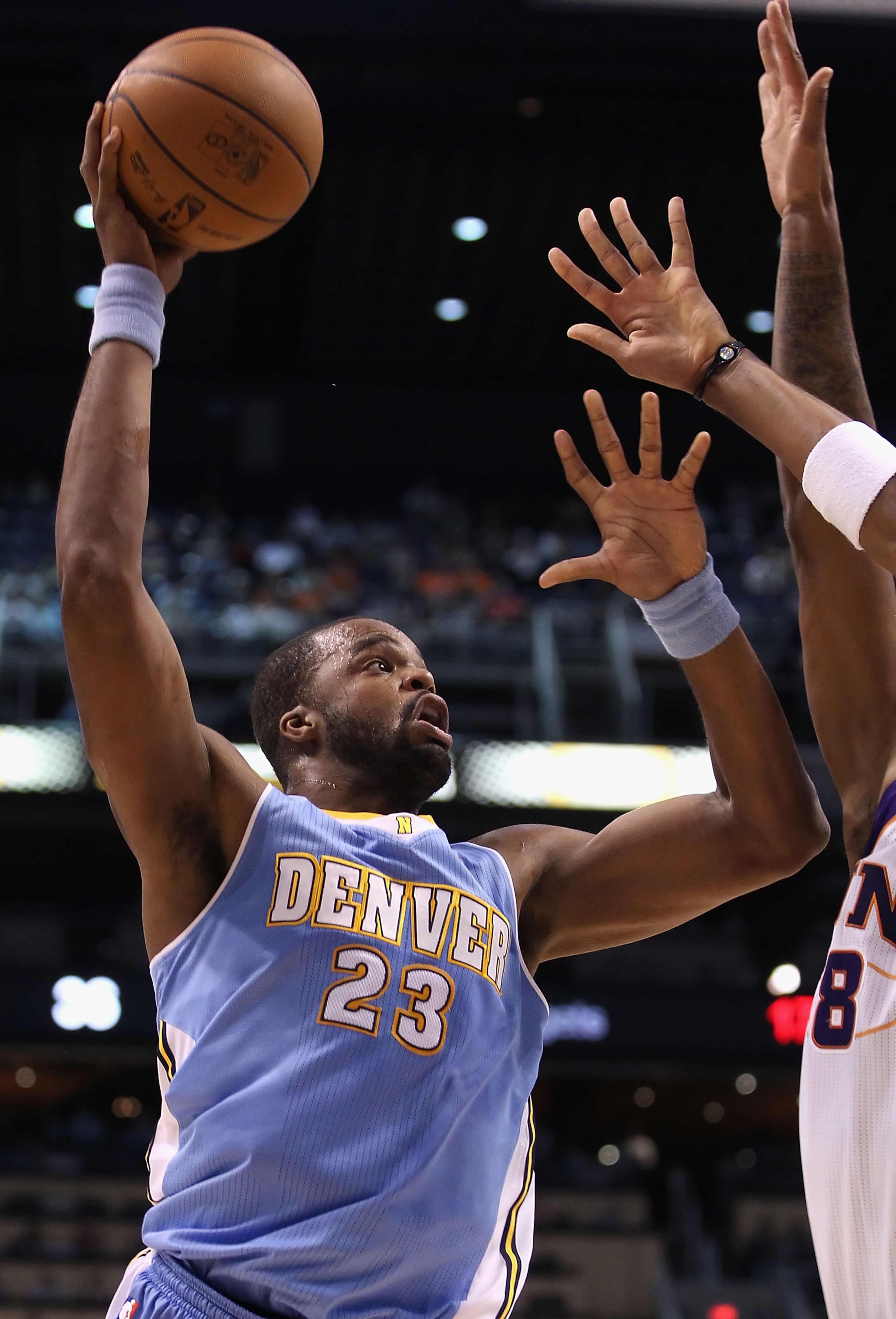 PHOENIX - OCTOBER 22: Shelden Williams #23 of the Denver Nuggets puts up a shot against the Phoenix Suns during the preseason NBA game at US Airways Center on October 22, 2010 in Phoenix, Arizona. NOTE TO USER: User expressly acknowledges and agrees that PHOENIX - OCTOBER 22: Shelden Williams #23 of the Denver Nuggets puts up a shot against the Phoenix Suns during the preseason NBA game at US Airways Center on October 22, 2010 in Phoenix, Arizona. NOTE TO USER: User expressly acknowledges and agrees that