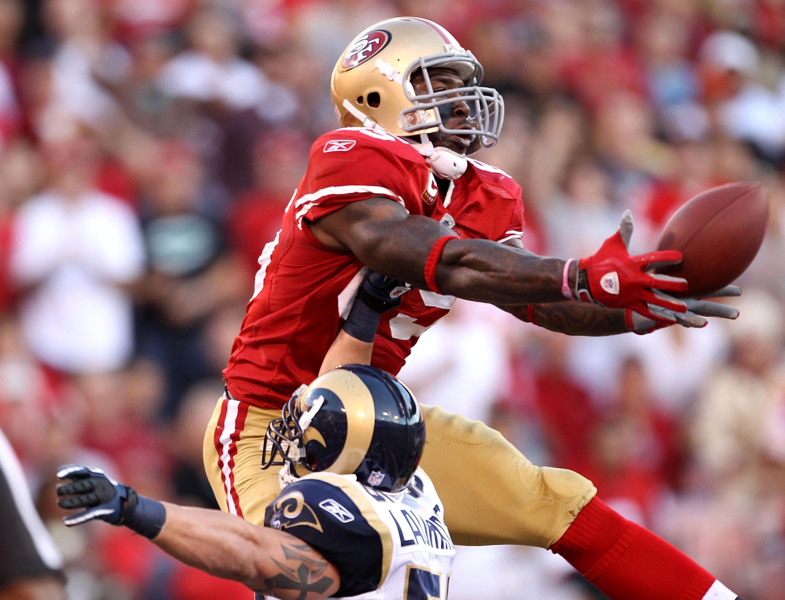 SAN FRANCISCO - NOVEMBER 14: Vernon Davis #85 of the San Francisco 49ers catches the ball in the endzone over James Laurinaitis #55 of the St. Louis Rams at Candlestick Park on November 14, 2010 in San Francisco, California. The touchdown was not allowed SAN FRANCISCO - NOVEMBER 14: Vernon Davis #85 of the San Francisco 49ers catches the ball in the endzone over James Laurinaitis #55 of the St. Louis Rams at Candlestick Park on November 14, 2010 in San Francisco, California. The touchdown was not allowed