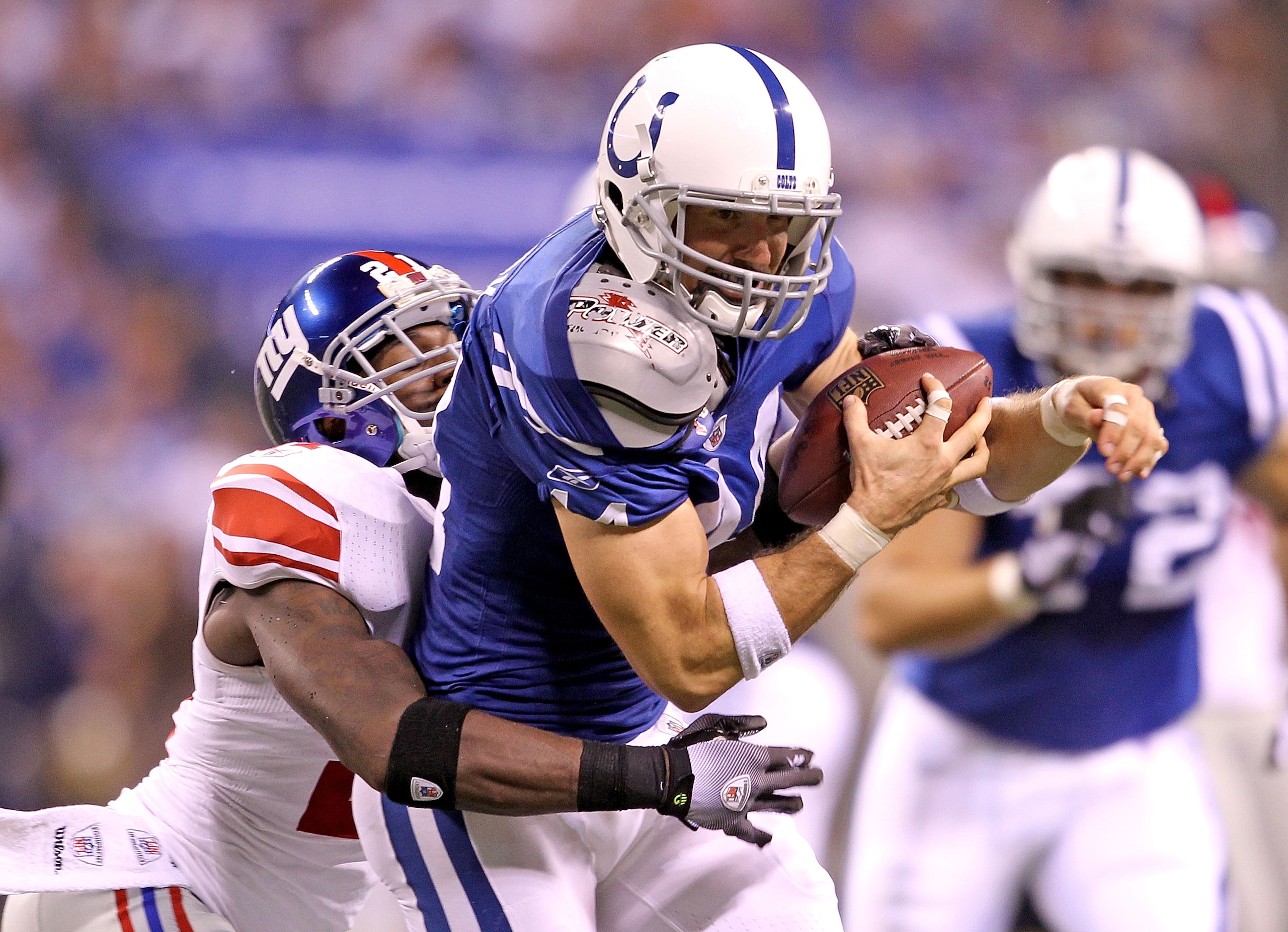 INDIANAPOLIS - SEPTEMBER 19: Dallas Clark #44 of the Indianapolis Colts catches a pass while defended by Kenny Phillips #21 of the New York Giants during the NFL game at Lucas Oil Stadium on September 19, 2010 in Indianapolis, Indiana. (Photo by Andy Ly INDIANAPOLIS - SEPTEMBER 19: Dallas Clark #44 of the Indianapolis Colts catches a pass while defended by Kenny Phillips #21 of the New York Giants during the NFL game at Lucas Oil Stadium on September 19, 2010 in Indianapolis, Indiana. (Photo by Andy Ly