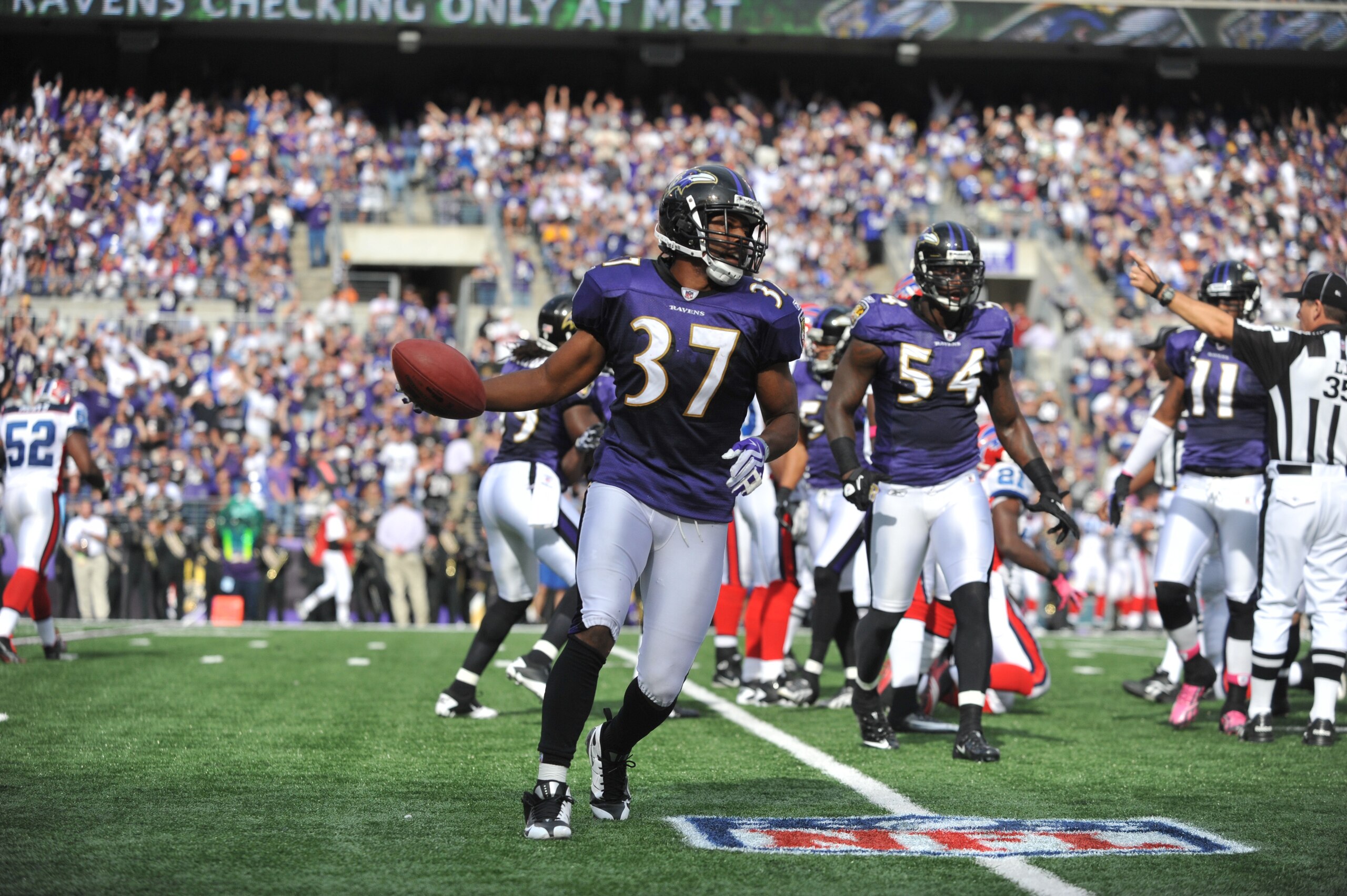 BALTIMORE, MD - OCTOBER 24:  Josh Wilson #37 of the Baltimore Ravens celebrates a fumble recovery against the Buffalo Bills at M&T Bank Stadium on October 24, 2010 in Baltimore, Maryland. The Ravens defeated the Bills 37-34. (Photo by Larry French/Getty I