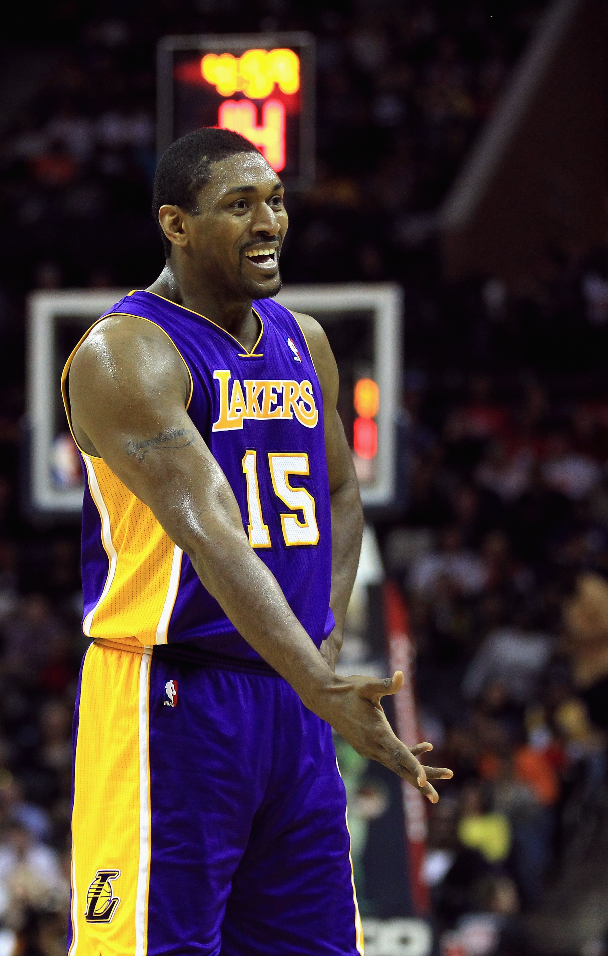 CHARLOTTE, NC - FEBRUARY 14: Ron Artest #15 of the Los Angeles Lakers reacts to a call against the Charlotte Bobcats during their game at Time Warner Cable Arena on February 14, 2011 in Charlotte, North Carolina. NOTE TO USER: User expressly acknowledges CHARLOTTE, NC - FEBRUARY 14: Ron Artest #15 of the Los Angeles Lakers reacts to a call against the Charlotte Bobcats during their game at Time Warner Cable Arena on February 14, 2011 in Charlotte, North Carolina. NOTE TO USER: User expressly acknowledges