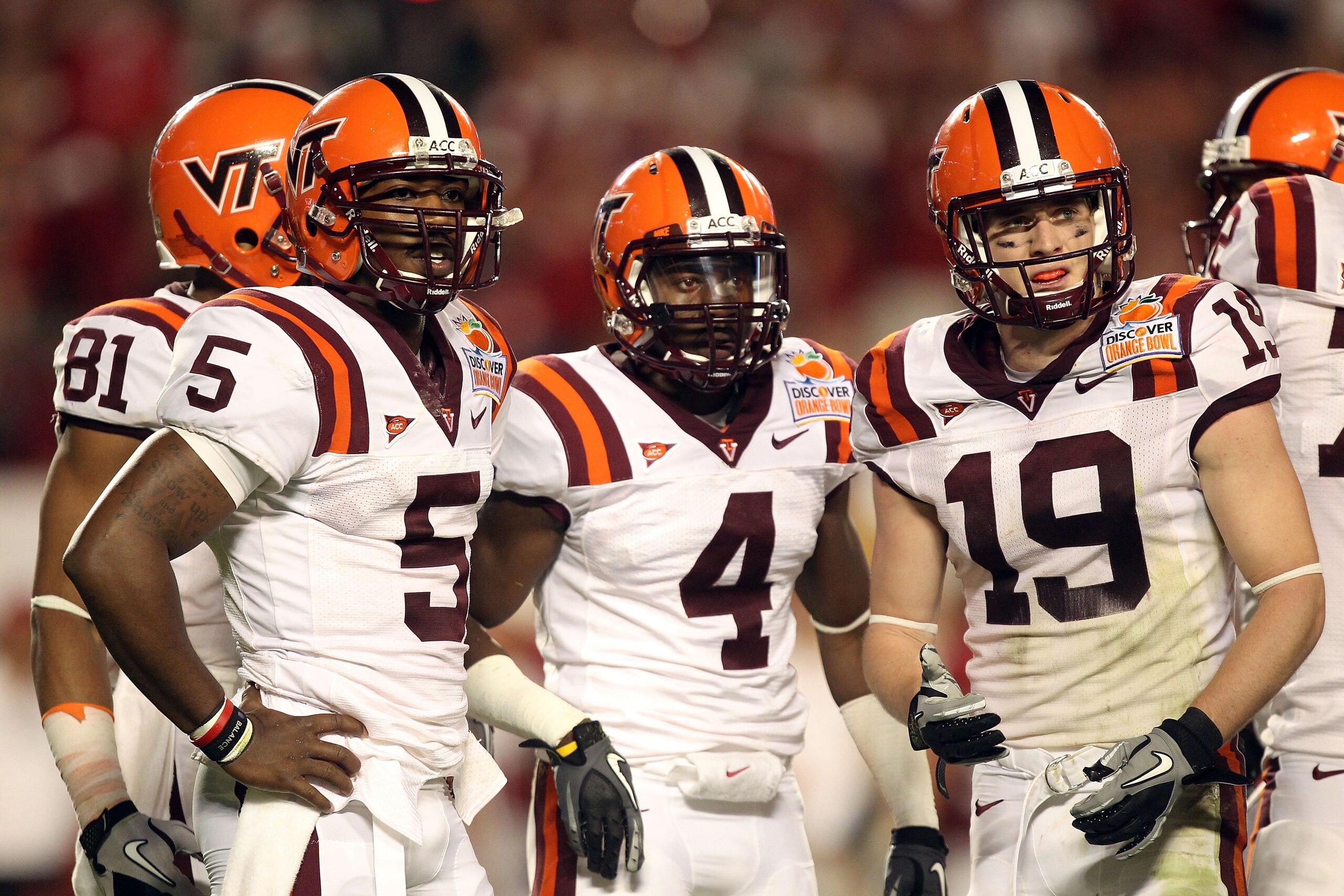 MIAMI, FL - JANUARY 03:  (L-R) Tyrod Taylor #5, David Wilson #4 and Danny Coale #19 of the Virginia Tech Hokies look towards the sideline against the Stanford Cardinal during the 2011 Discover Orange Bowl at Sun Life Stadium on January 3, 2011 in Miami, F