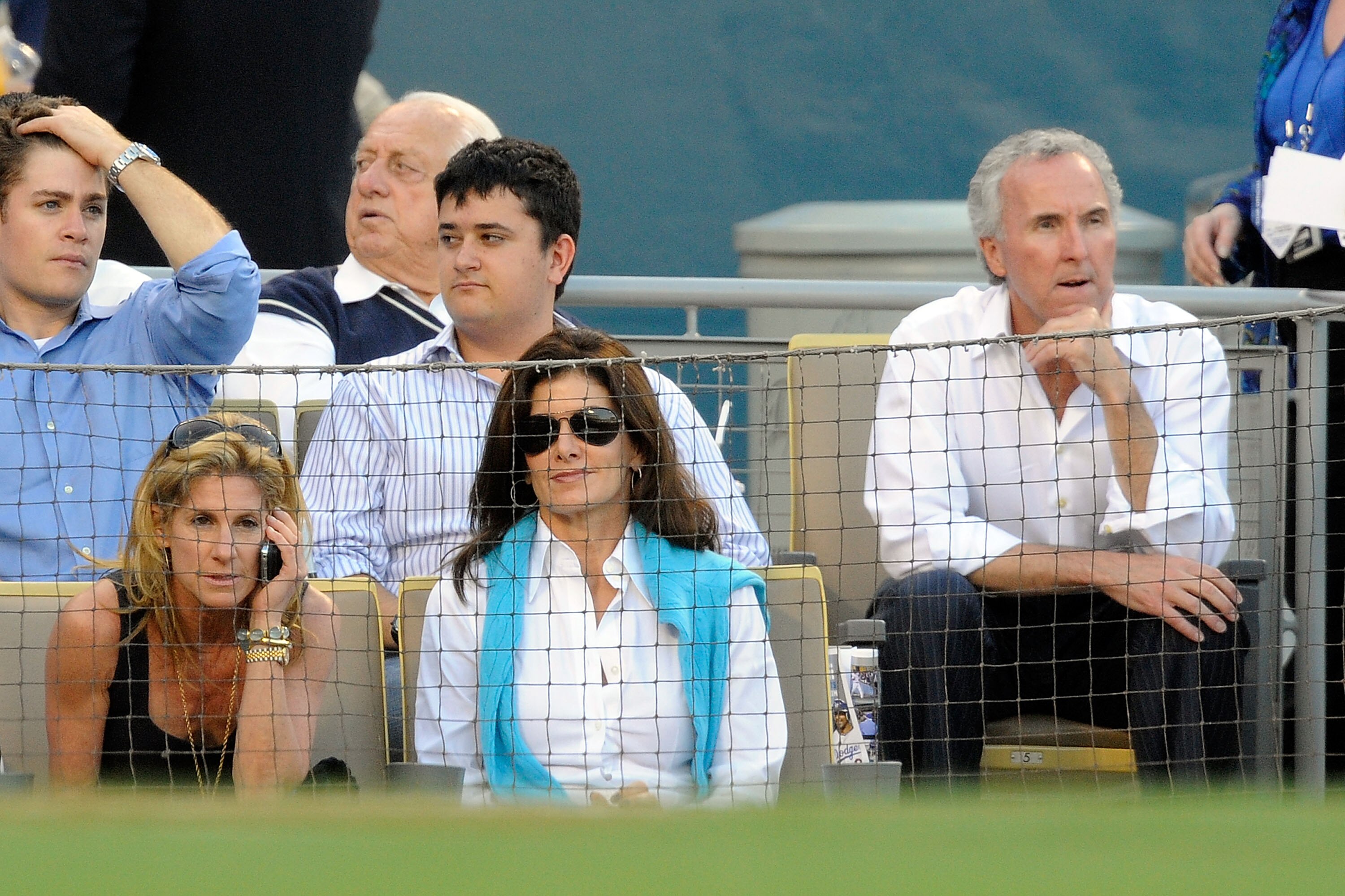 LOS ANGELES, CA - OCTOBER 15:  Owner Frank McCourt, far rignt, and wife and Dodgers president, Jamie McCourt, far left, of the Los Angeles Dodgers take their separate seats during Game One of the NLCS agianst the Philadelphia Phillies during the 2009 MLB