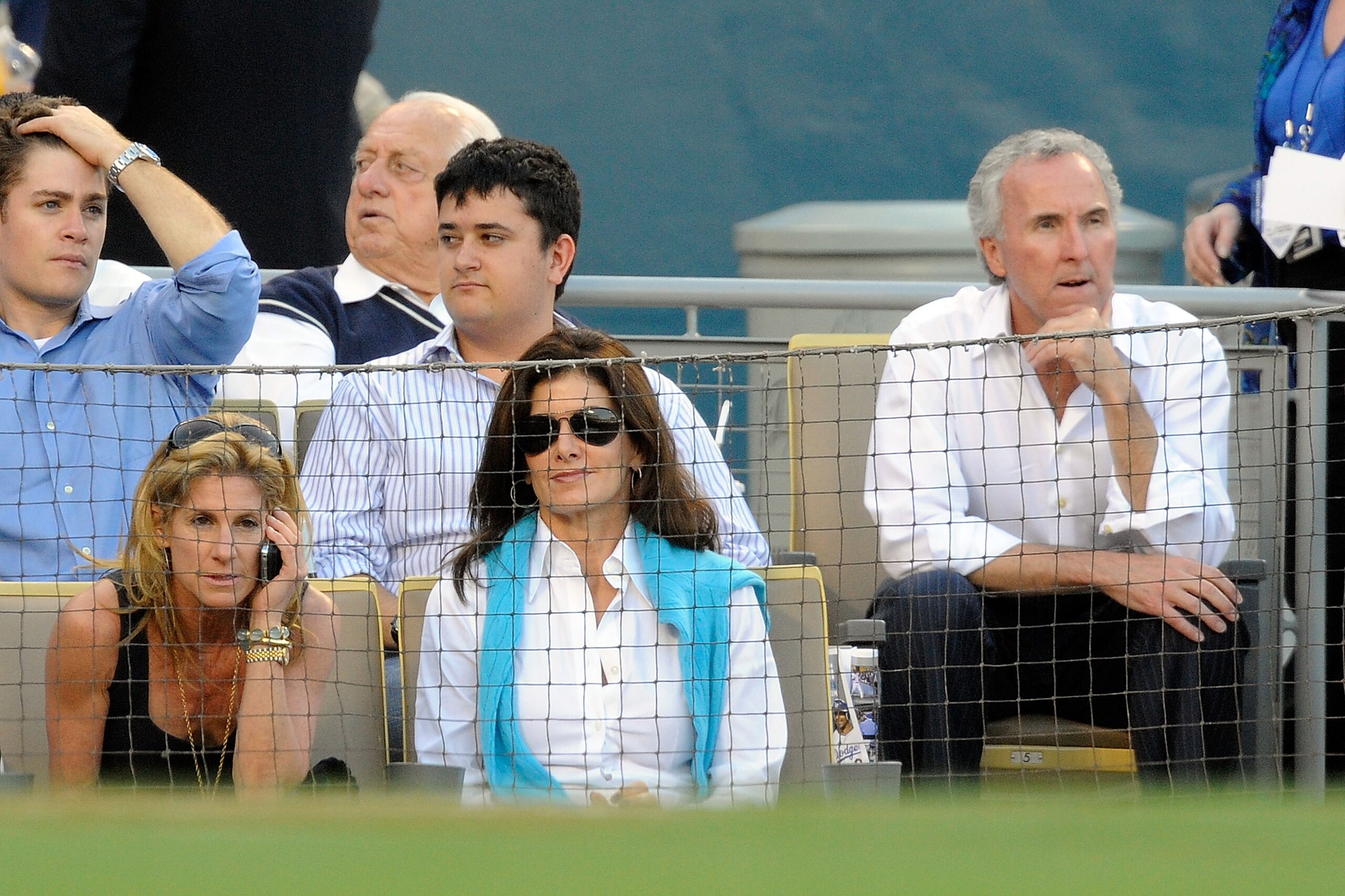 LOS ANGELES, CA - OCTOBER 15: Owner Frank McCourt, far rignt, and wife and Dodgers president, Jamie McCourt, far left, of the Los Angeles Dodgers take their separate seats during Game One of the NLCS agianst the Philadelphia Phillies during the 2009 MLB LOS ANGELES, CA - OCTOBER 15: Owner Frank McCourt, far rignt, and wife and Dodgers president, Jamie McCourt, far left, of the Los Angeles Dodgers take their separate seats during Game One of the NLCS agianst the Philadelphia Phillies during the 2009 MLB
