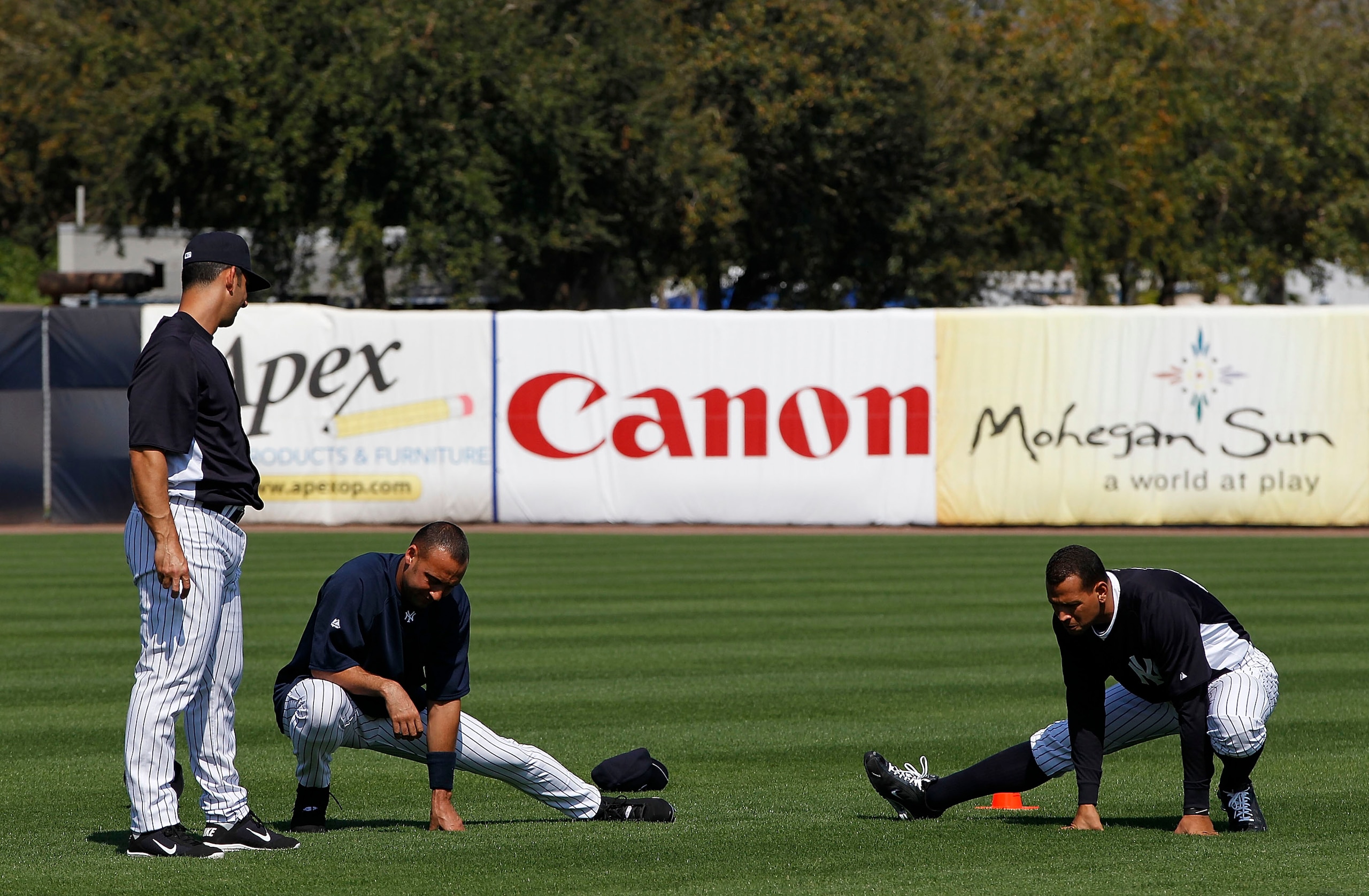 TAMPA, FL - FEBRUARY 20: Jorge Posada #20 Derek Jeter #2 and Alex Rodriguez #13 of the New York Yankees stretch prior to the start if the first full team workout of Spring Training on February 20, 2011 at the George M. Steinbrenner Field in Tampa, Florid TAMPA, FL - FEBRUARY 20: Jorge Posada #20 Derek Jeter #2 and Alex Rodriguez #13 of the New York Yankees stretch prior to the start if the first full team workout of Spring Training on February 20, 2011 at the George M. Steinbrenner Field in Tampa, Florid