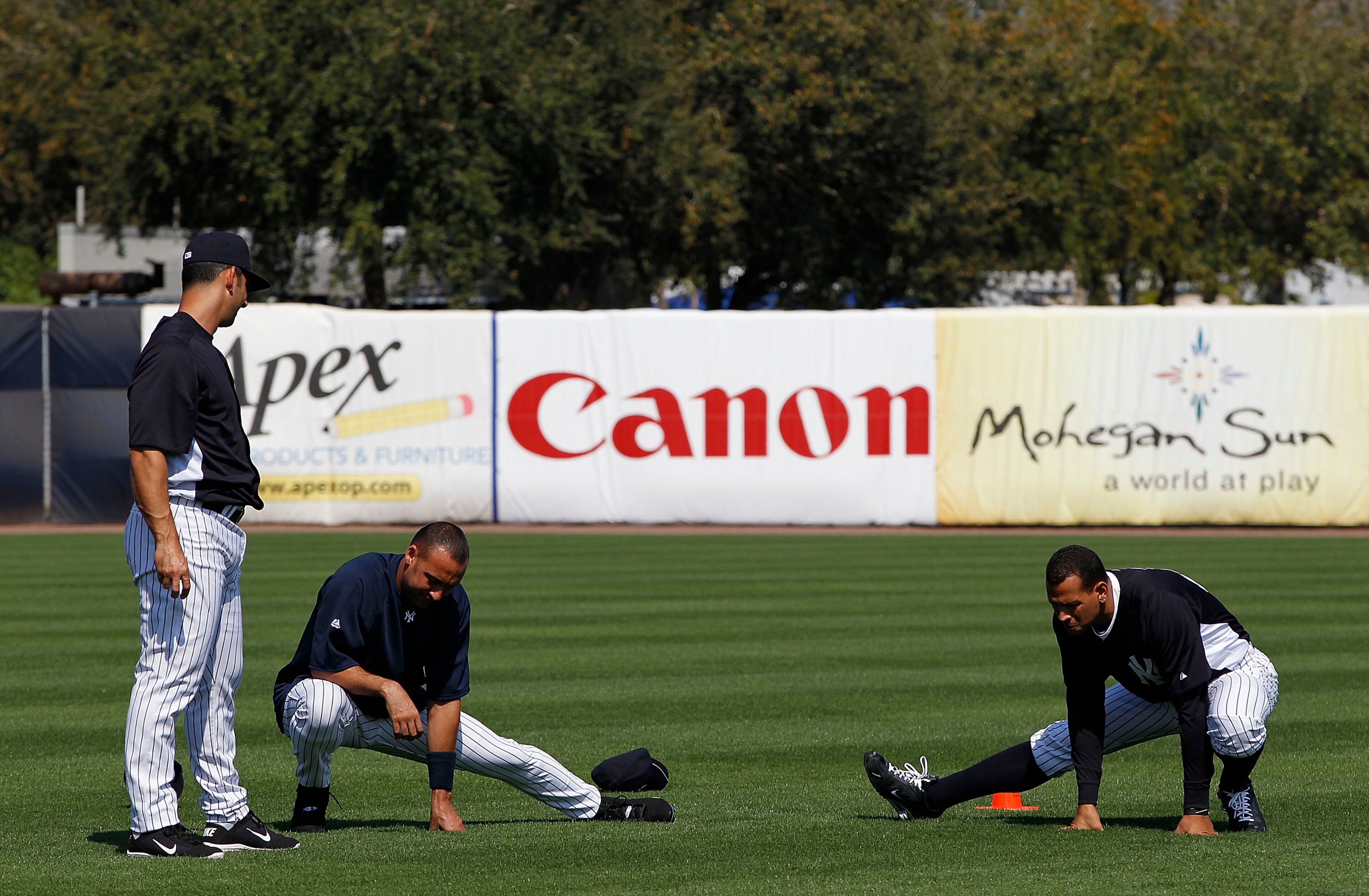 TAMPA, FL - FEBRUARY 20: Jorge Posada #20 Derek Jeter #2 and Alex Rodriguez #13 of the New York Yankees stretch prior to the start if the first full team workout of Spring Training on February 20, 2011 at the George M. Steinbrenner Field in Tampa, Florid TAMPA, FL - FEBRUARY 20: Jorge Posada #20 Derek Jeter #2 and Alex Rodriguez #13 of the New York Yankees stretch prior to the start if the first full team workout of Spring Training on February 20, 2011 at the George M. Steinbrenner Field in Tampa, Florid