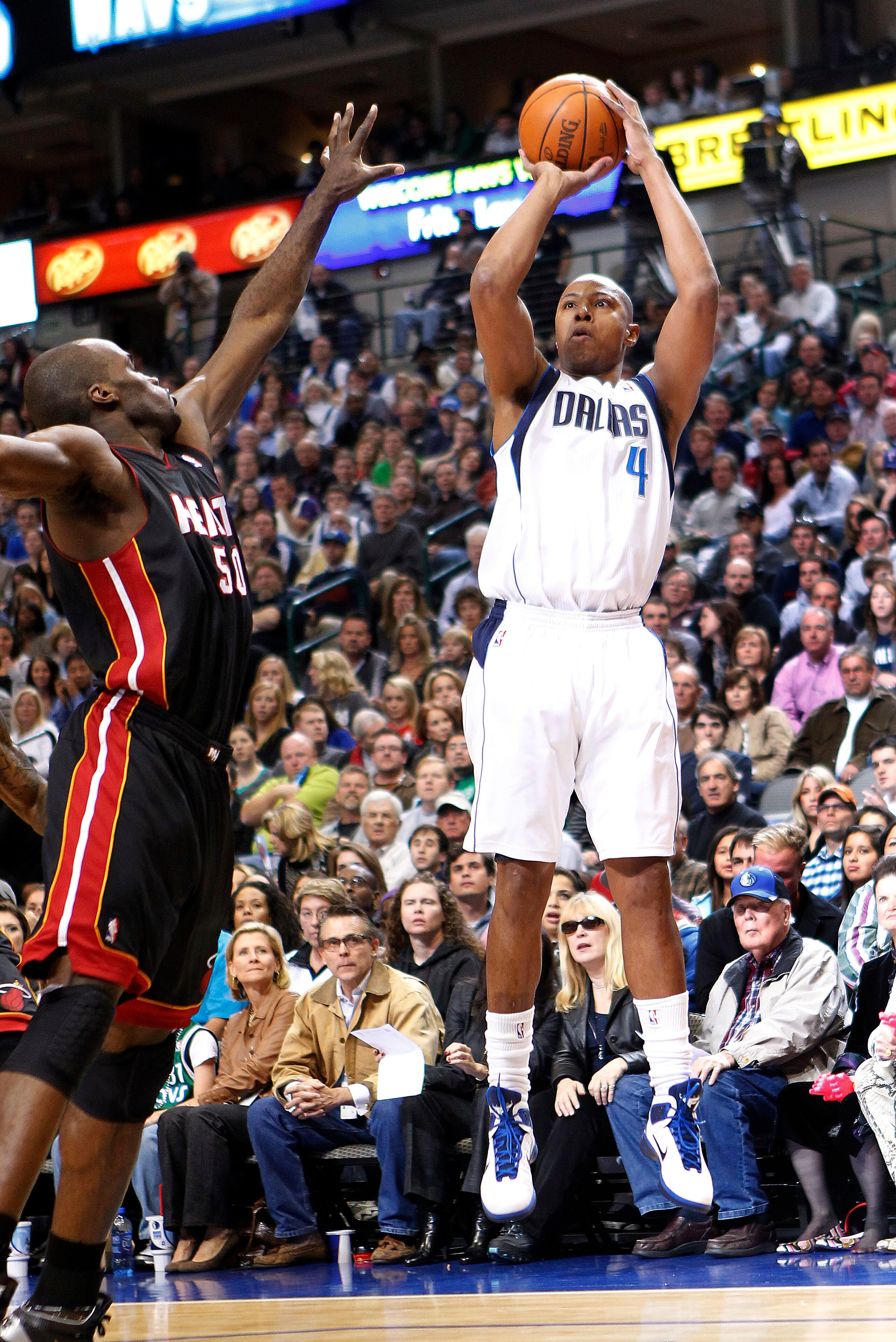 DALLAS - NOVEMBER 27: Caron Butler #4 of the Dallas Mavericks shoots over Joel Anthony #50 of the Miami Heat on November 27, 2010 at the American Airlines Center in Dallas, Texas. NOTE TO USER: User expressly acknowledges and agrees that, by downloading a