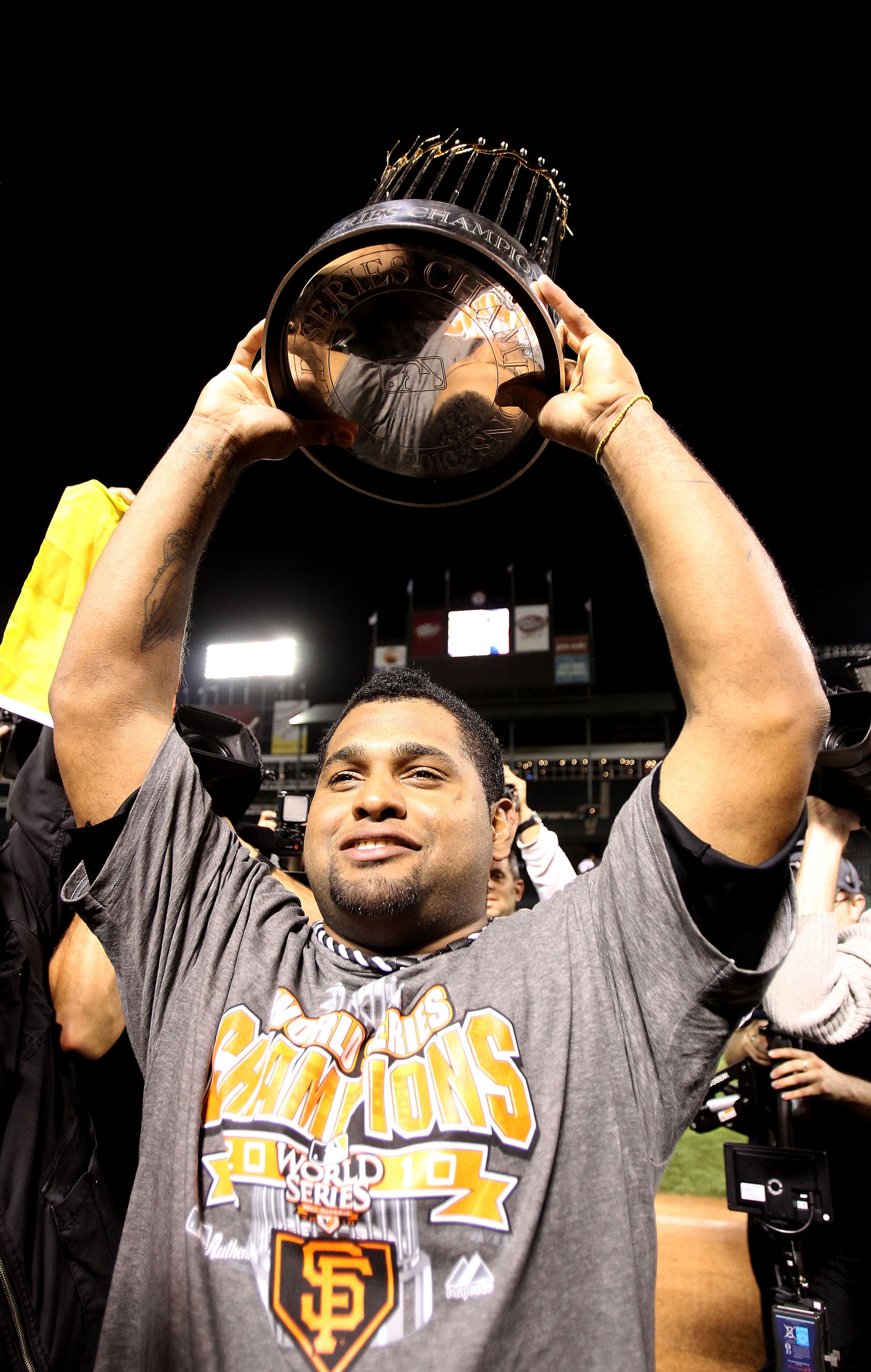ARLINGTON, TX - NOVEMBER 01: Pablo Sandovalof the San Francisco Giants celebrates with the World Series Championship trophy after the Giants won 3-1 the Texas Rangers in Game Five of the 2010 MLB World Series at Rangers Ballpark in Arlington on November ARLINGTON, TX - NOVEMBER 01: Pablo Sandovalof the San Francisco Giants celebrates with the World Series Championship trophy after the Giants won 3-1 the Texas Rangers in Game Five of the 2010 MLB World Series at Rangers Ballpark in Arlington on November
