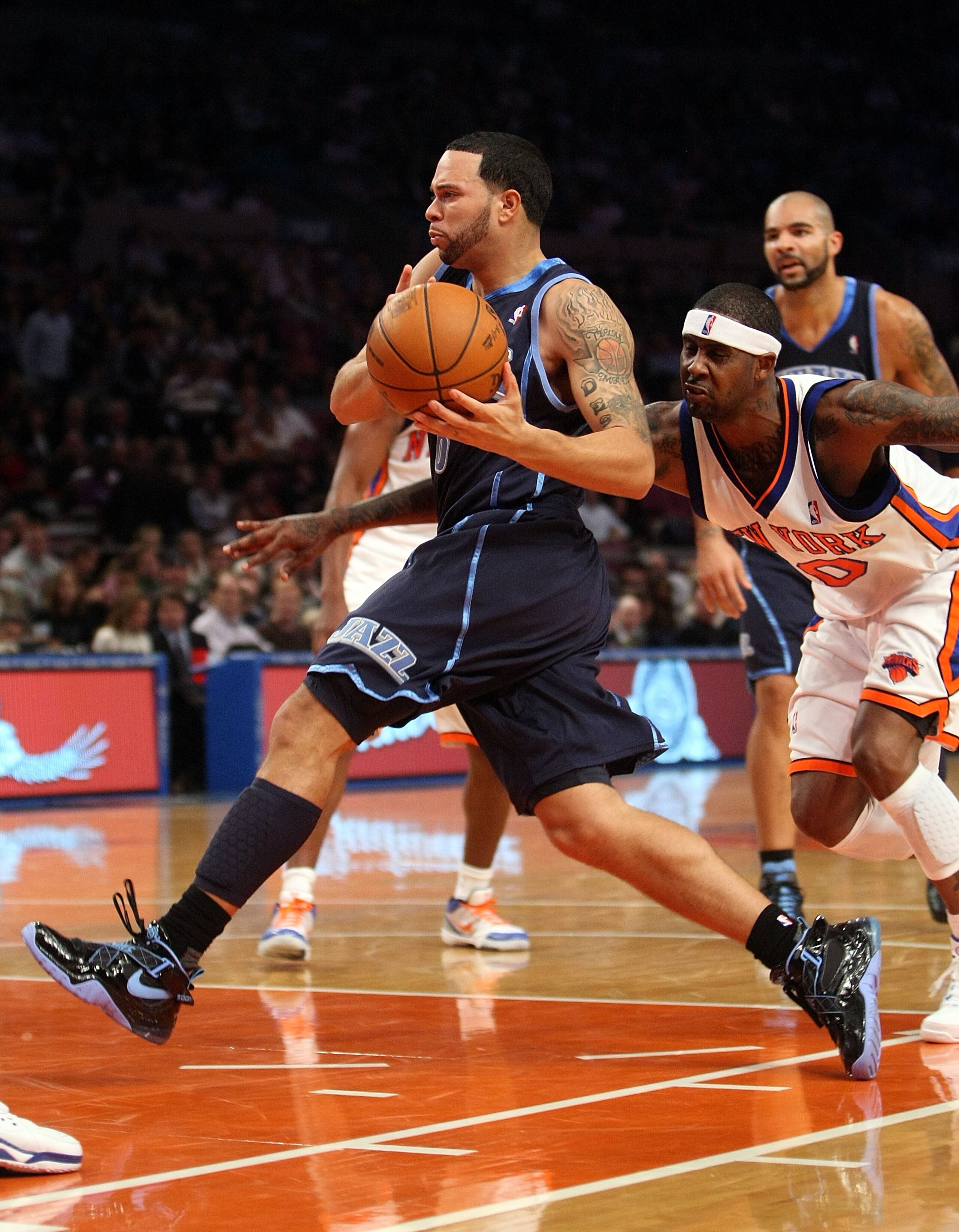 NEW YORK - NOVEMBER 09: Deron Williams #8 of the Utah Jazz drives to the basket against the New York Knicks at Madison Square Garden on November 9, 2009 in New York City.  NOTE TO USER: User expressly acknowledges and agrees that, by downloading and/or us