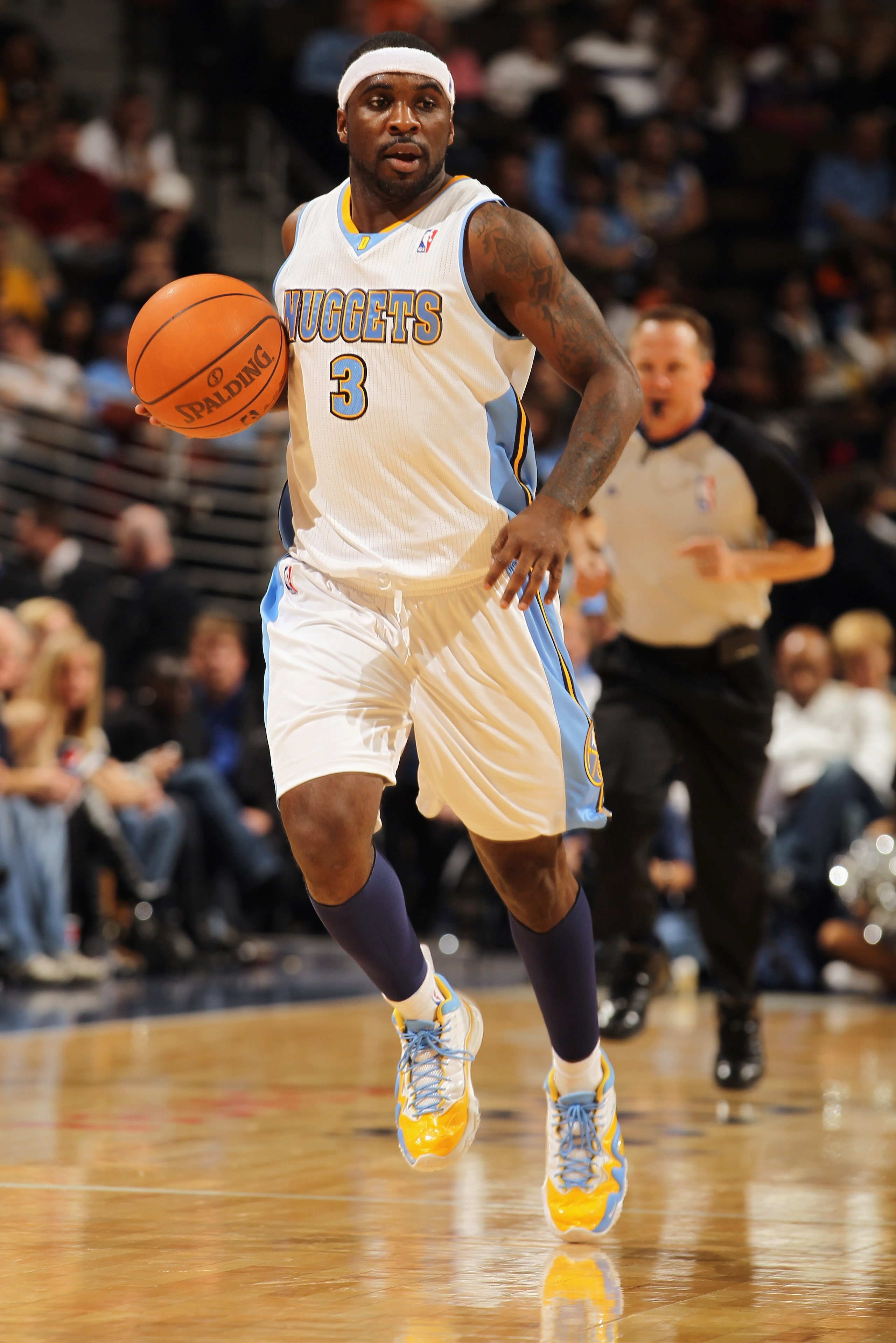 DENVER - NOVEMBER 16: Ty Lawson #3 of the Denver Nuggets dribbles the ball against the New York Knicks at the Pepsi Center on November 16, 2010 in Denver, Colorado. The Nuggets defeated the Knicks 120-118. NOTE TO USER: User expressly acknowledges and ag DENVER - NOVEMBER 16: Ty Lawson #3 of the Denver Nuggets dribbles the ball against the New York Knicks at the Pepsi Center on November 16, 2010 in Denver, Colorado. The Nuggets defeated the Knicks 120-118. NOTE TO USER: User expressly acknowledges and ag