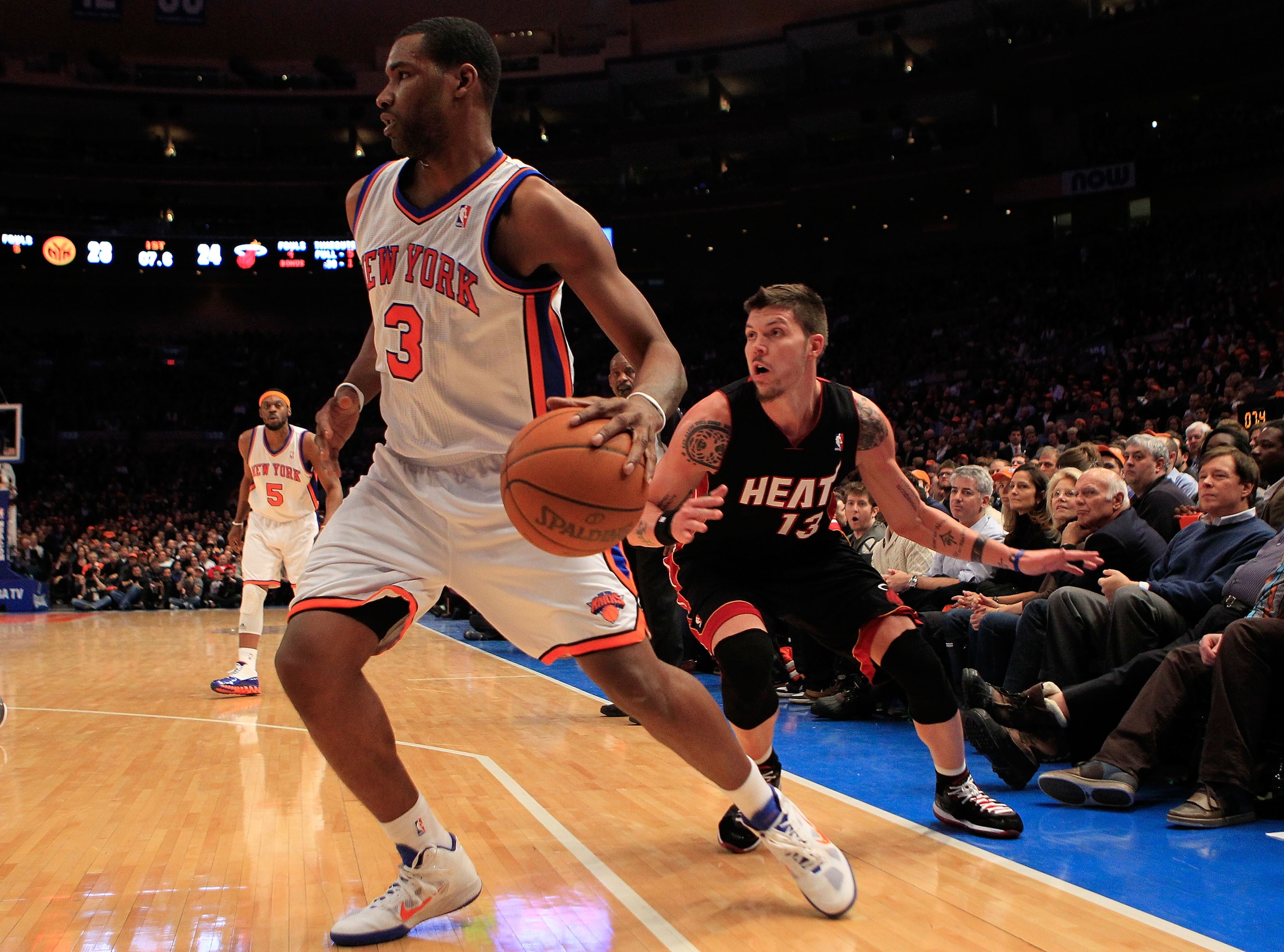 NEW YORK, NY - JANUARY 27: Shawne Williams #3 of the New York Knicks drives past Mike Miller #13 of the Miami Heat at Madison Square Garden on January 27, 2011 in New York City. NOTE TO USER: User expressly acknowledges and agrees that, by downloading and