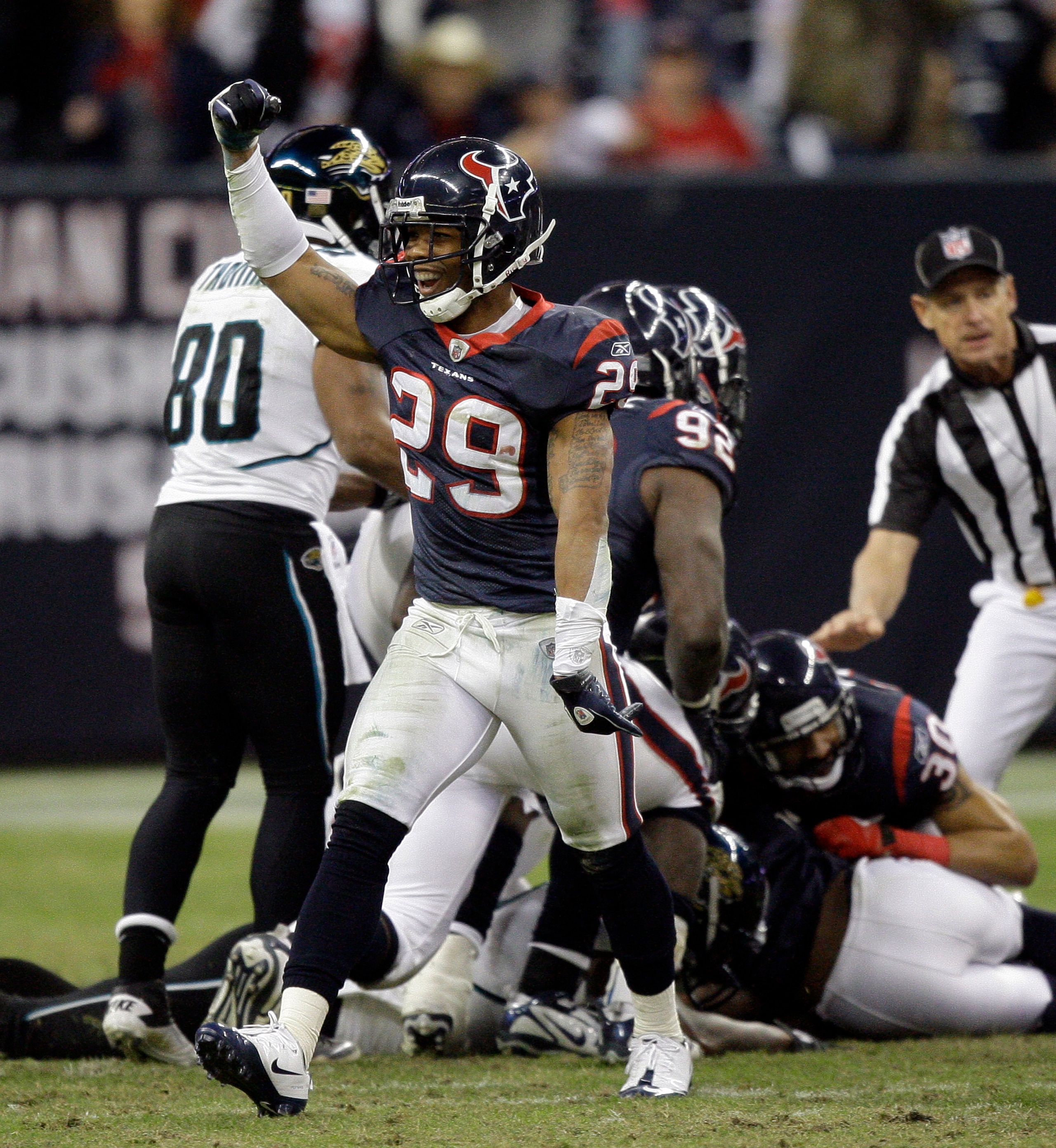 HOUSTON - JANUARY 02:  Glover Quin #29 of the Houston Texans celebrates after recovering a fumble late in the fourth quarter against the Jacksonville Jaguars at Reliant Stadium on January 2, 2011 in Houston, Texas.  (Photo by Bob Levey/Getty Images)