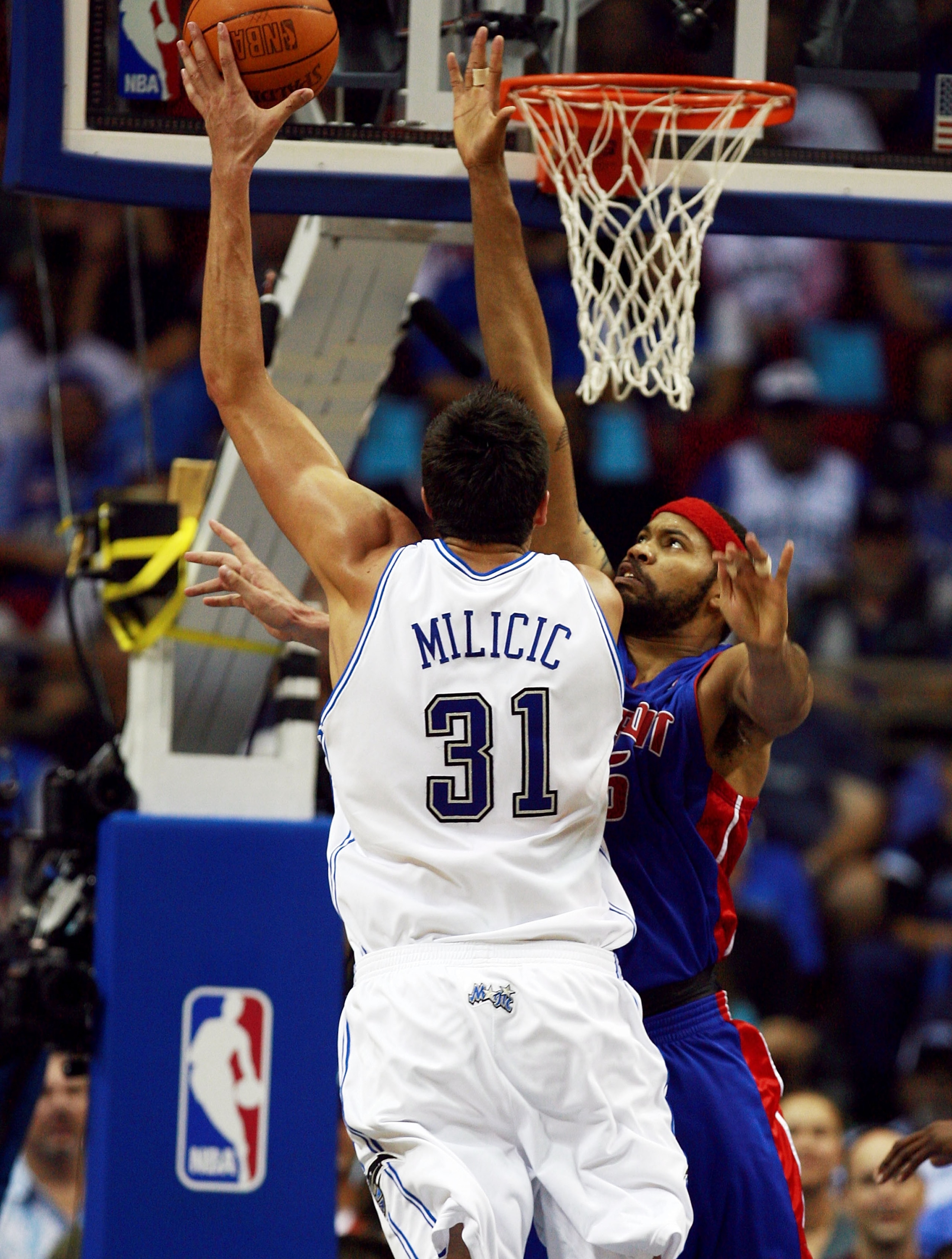 ORLANDO, FL - APRIL 28:  Darko Milicic #31 of the Orlando Magic scores over Rasheed Wallace #36 of the Detroit Pistons in Game Four of the Eastern Conference Quarterfinals during the 2007 NBA Playoffs at Amway Arena on April 28, 2007 in Orlando, Florida.