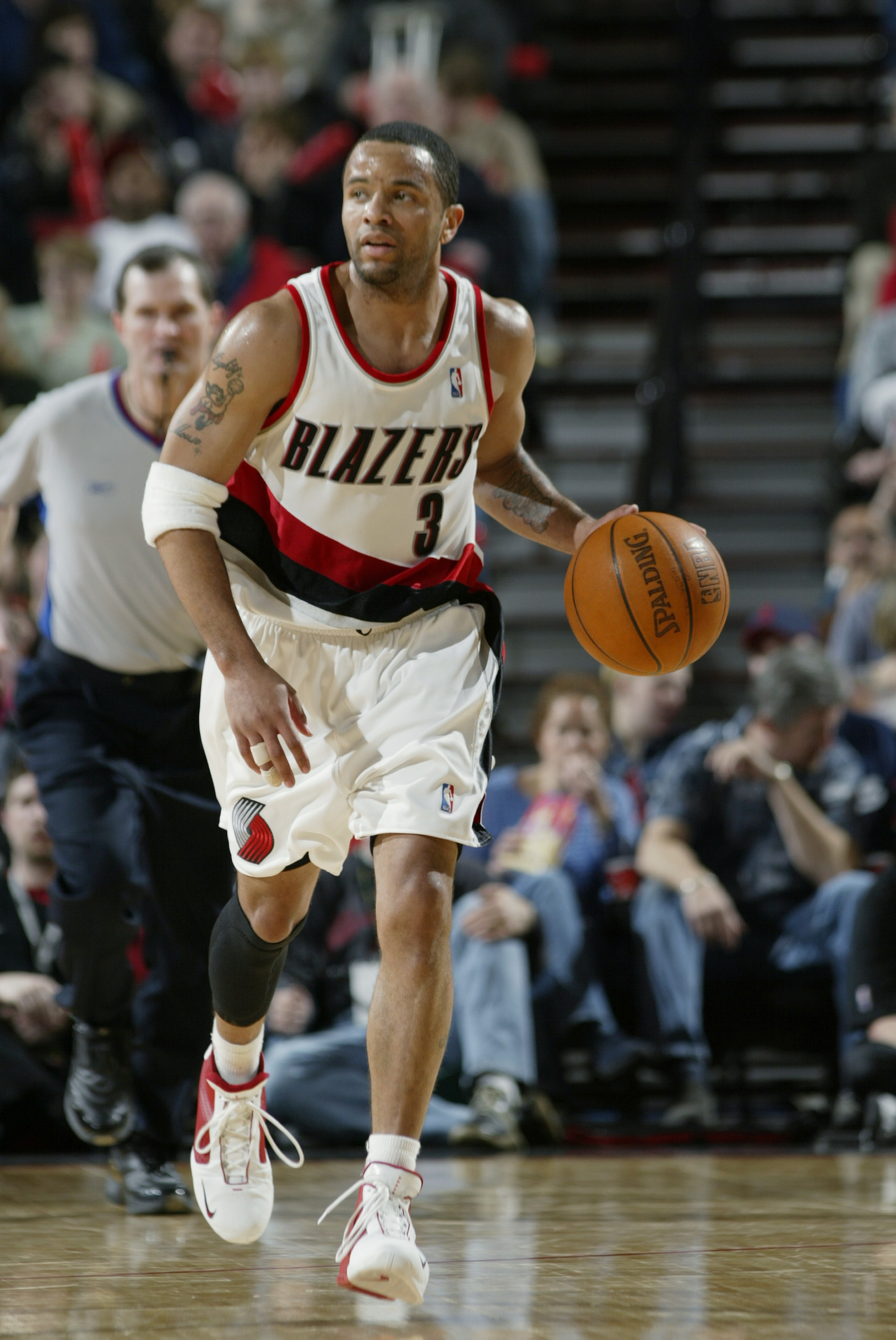PORTLAND - FEBRUARY 21:  Damon Stoudamire #3 of the Portland Trail Blazers moves the ball up court during the game against the Boston Celtics at the Rose Garden on February 21, 2003 in Portland, Oregon.  The Trail Blazers won 105-84 .  NOTE TO USER: User