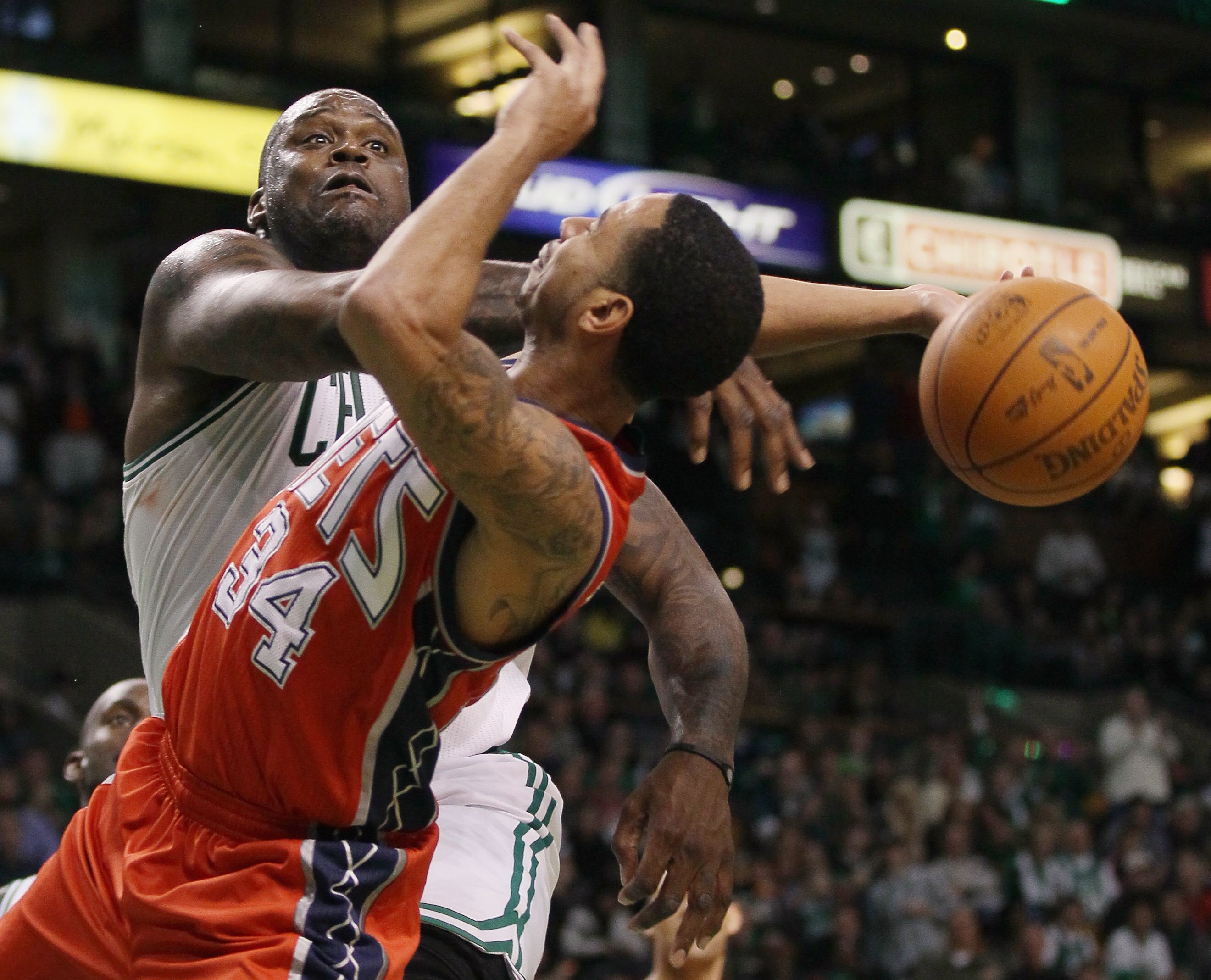 BOSTON - NOVEMBER 24:  Shaquille O'Neal #36 of the Boston Celtics blocks a shot by Devin Harris #34 of the New Jersey Nets on November 24, 2010 at the TD Garden in Boston, Massachusetts. The Celtics defeated the nets 89-83. NOTE TO USER: User expressly ac