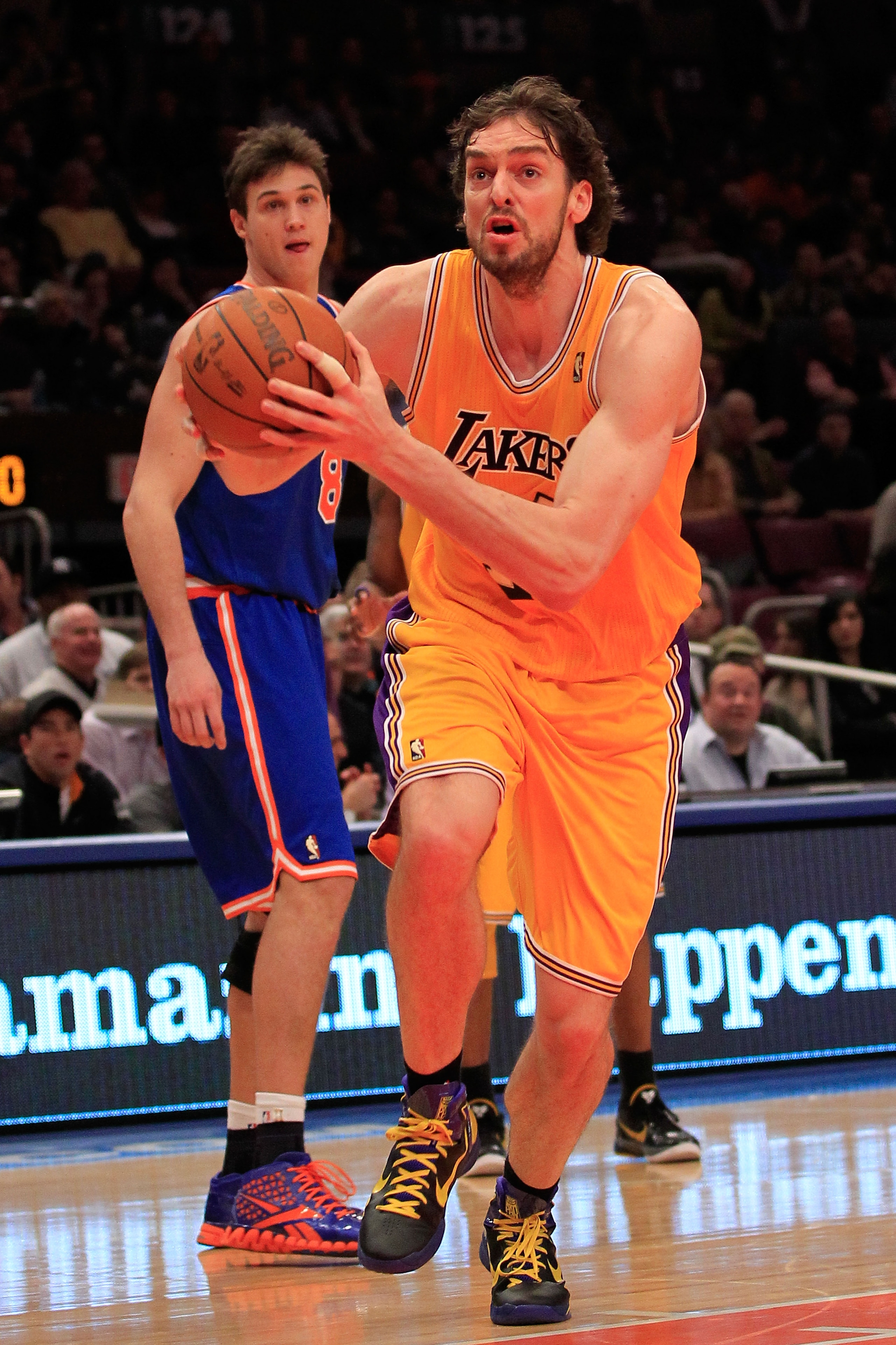 NEW YORK, NY - FEBRUARY 11:  Pau Gasol #16 of the Los Angeles Lakers drives past Danilo Gallinari #8 of the New York Knicks at Madison Square Garden on February 11, 2011 in New York City. NOTE TO USER: User expressly acknowledges and agrees that, by downl