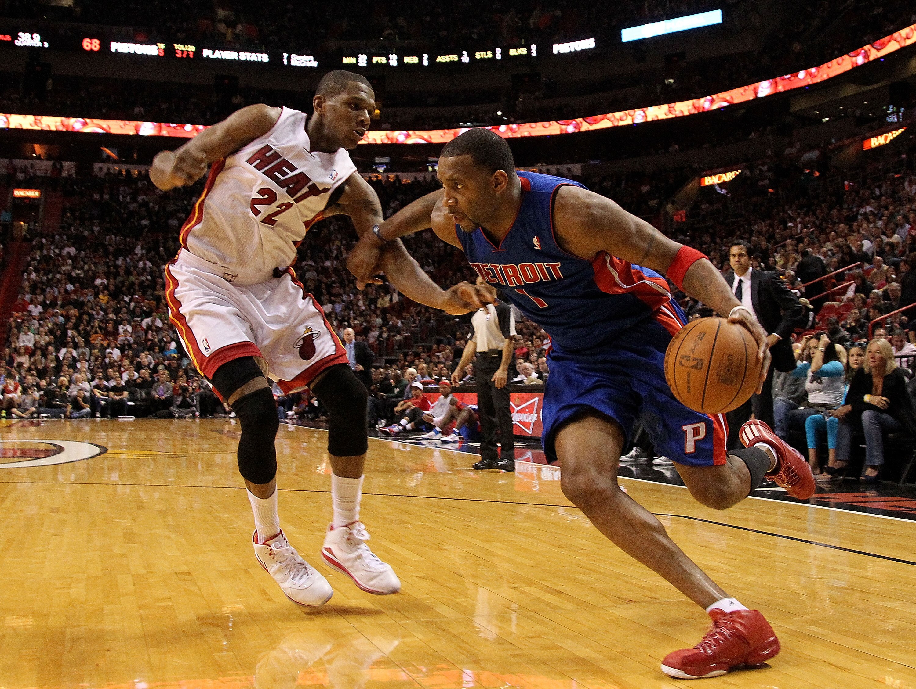 MIAMI, FL - JANUARY 28:  Tracy McGrady #1 of of the Detroit Pistons drives against James Jones #22 of the Miami Heat during a game at American Airlines Arena on January 28, 2011 in Miami, Florida. NOTE TO USER: User expressly acknowledges and agrees that,