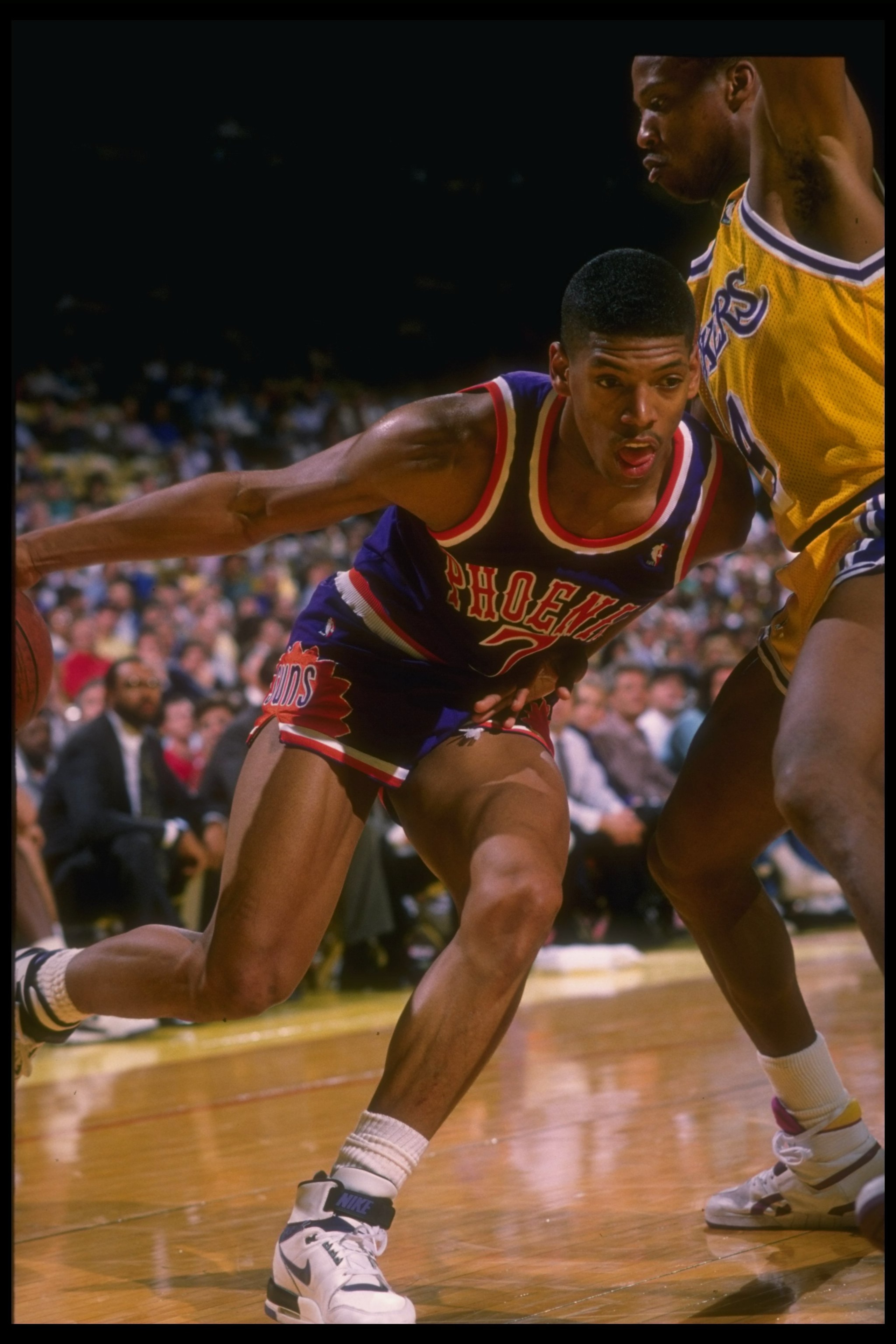 1988-1989:  Guard Kevin Johnson of the Phoenix Suns moves the ball during a game. Mandatory Credit: Mike Powell  /Allsport Mandatory Credit: Mike Powell  /Allsport