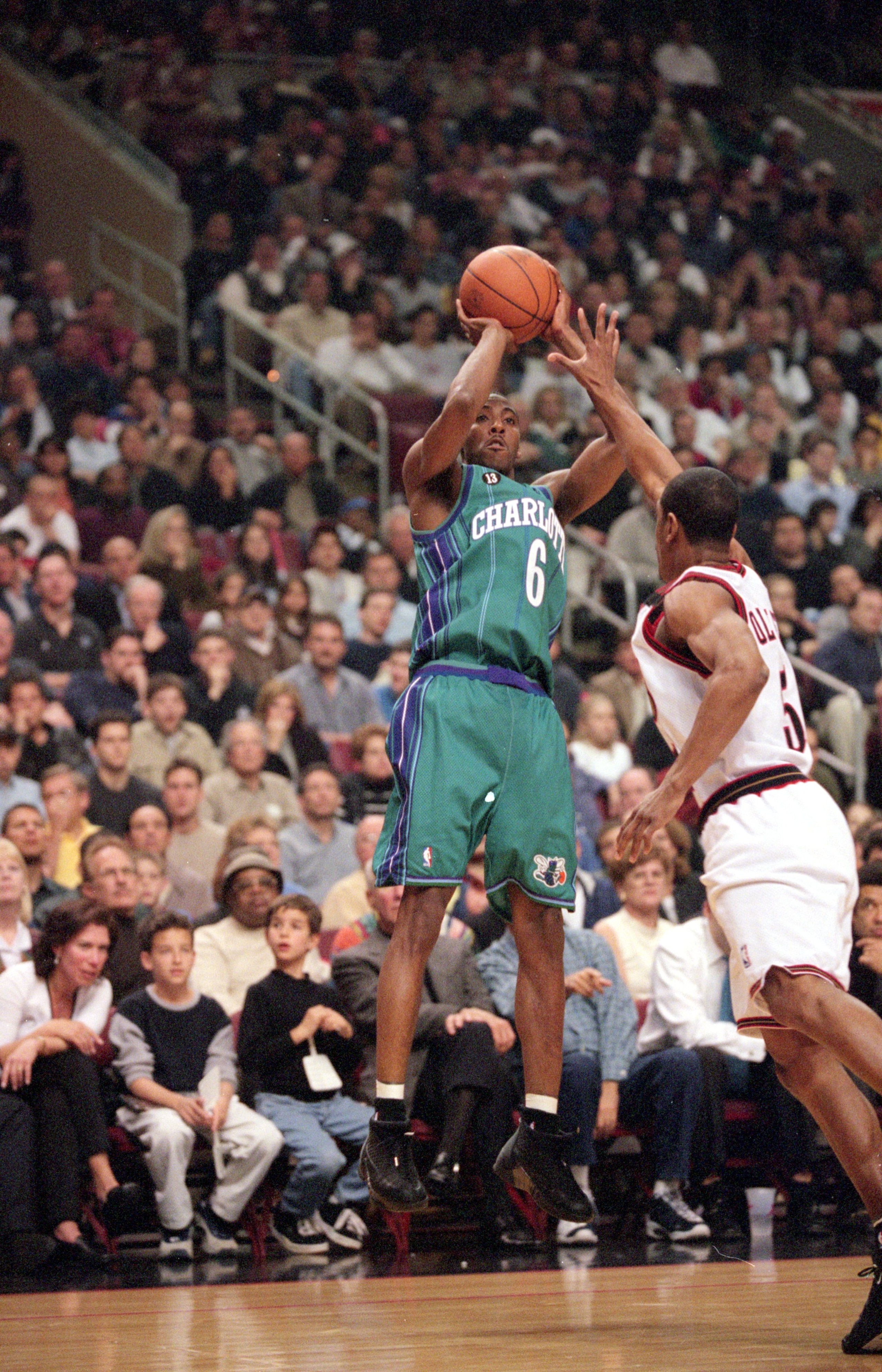 28 Apr 2000: Eddie Jones #6 of the Charlotte Hornets makes a jump shot as he is blocked by Kevin Ollie #5 of the Philadelpha 76ers during the NBA Eastern Conference Playoffs Round One Game at the First Union Center in Philadelphia, Pennsylvania. The 76ers