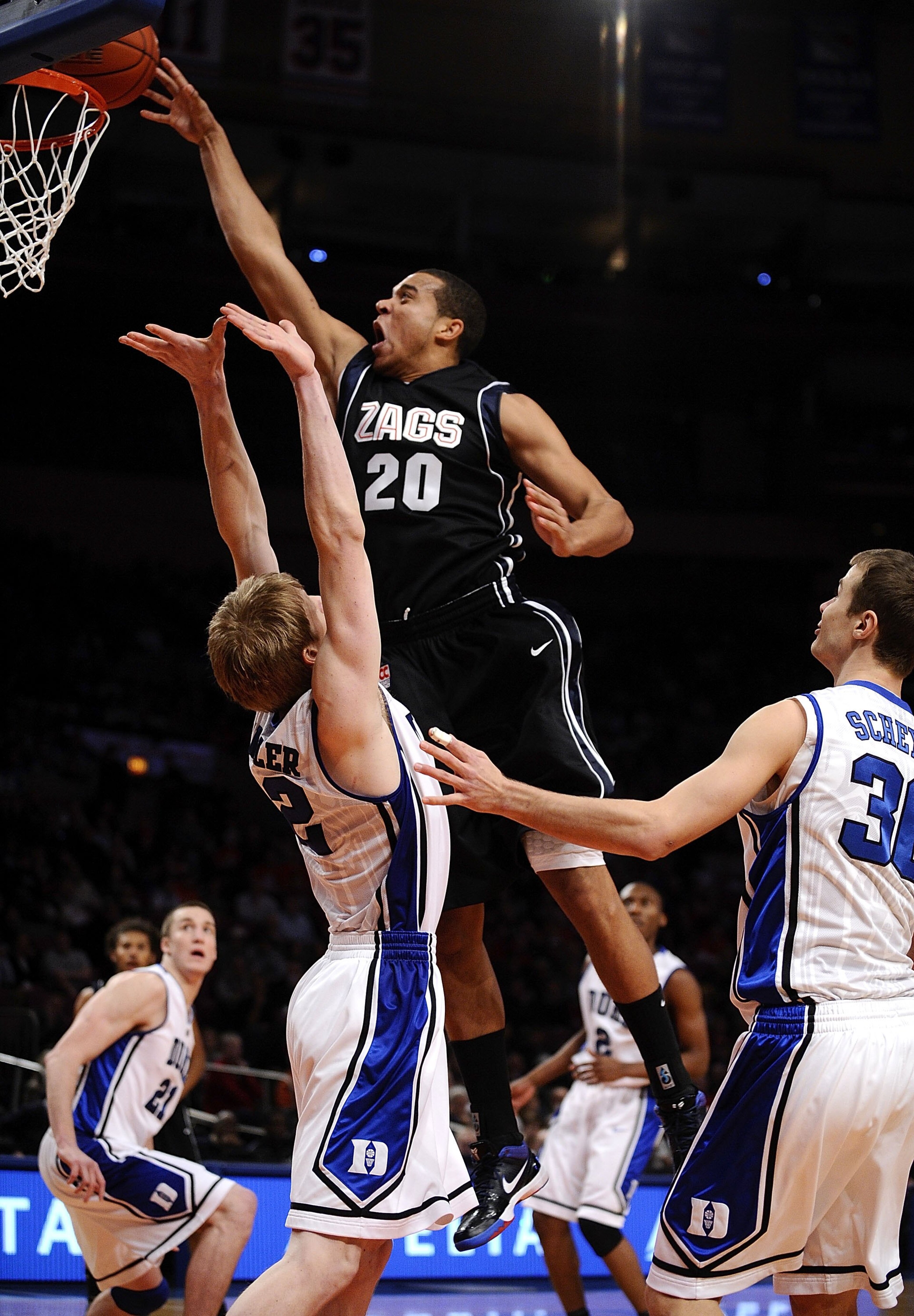 NEW YORK - DECEMBER 19: Elias Harris #20 of the Gonzaga Bulldogs puts up a shot over Kyle Singler #12 of the Duke Blue Devils in the Aeropostale Classic at Madison Square Garden on December 19, 2009 in New York City. (Photo by Jeff Zelevansky/Getty Imag NEW YORK - DECEMBER 19: Elias Harris #20 of the Gonzaga Bulldogs puts up a shot over Kyle Singler #12 of the Duke Blue Devils in the Aeropostale Classic at Madison Square Garden on December 19, 2009 in New York City. (Photo by Jeff Zelevansky/Getty Imag