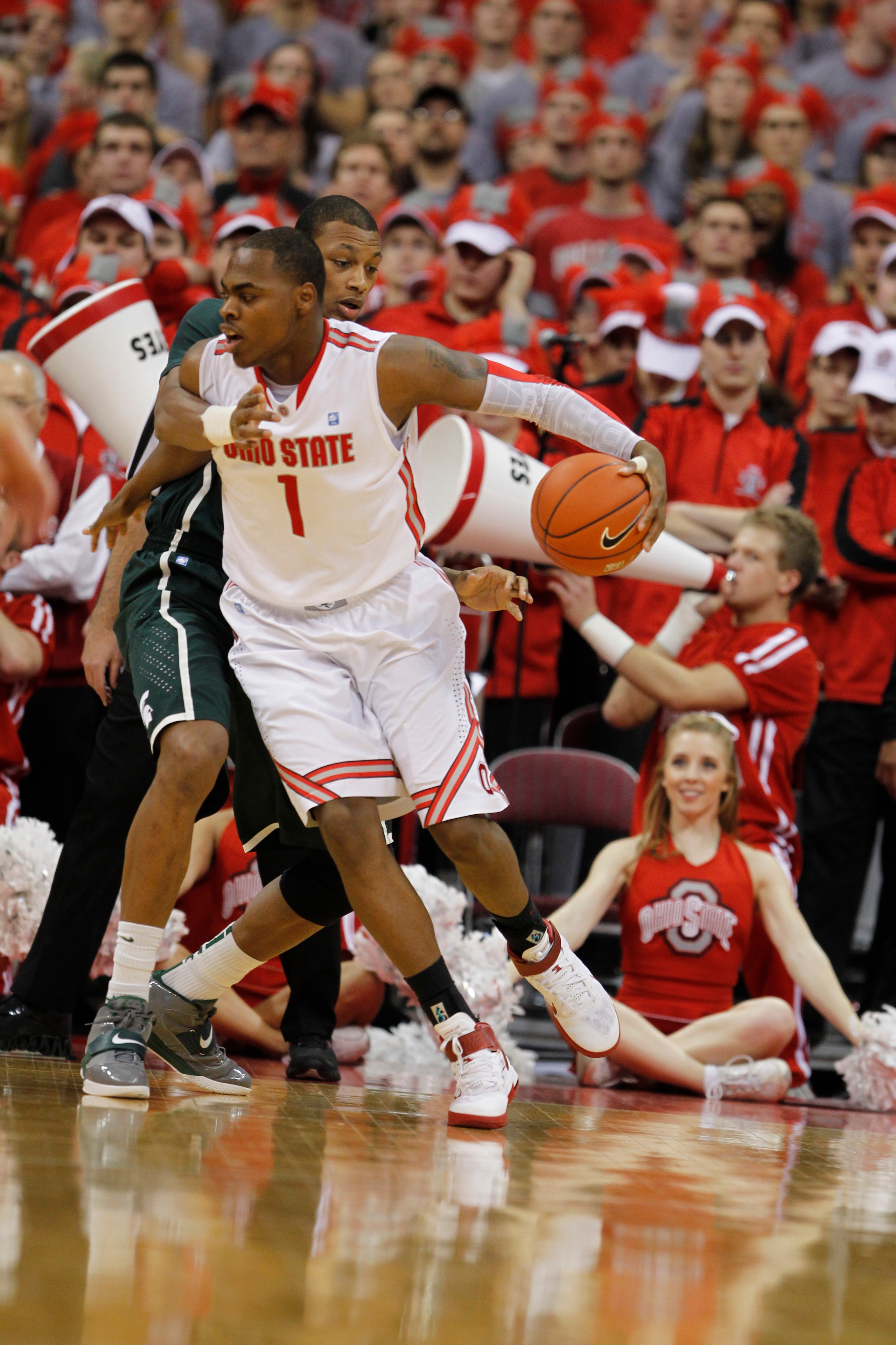 COLUMBUS, OH - FEBRUARY 15:  Deshaun Thomas #1 of the Ohio State Buckeyes controls the ball while playing the Michigan State Spartans on February 15, 2011 at Value City Arena in Columbus, Ohio.  (Photo by Gregory Shamus/Getty Images)