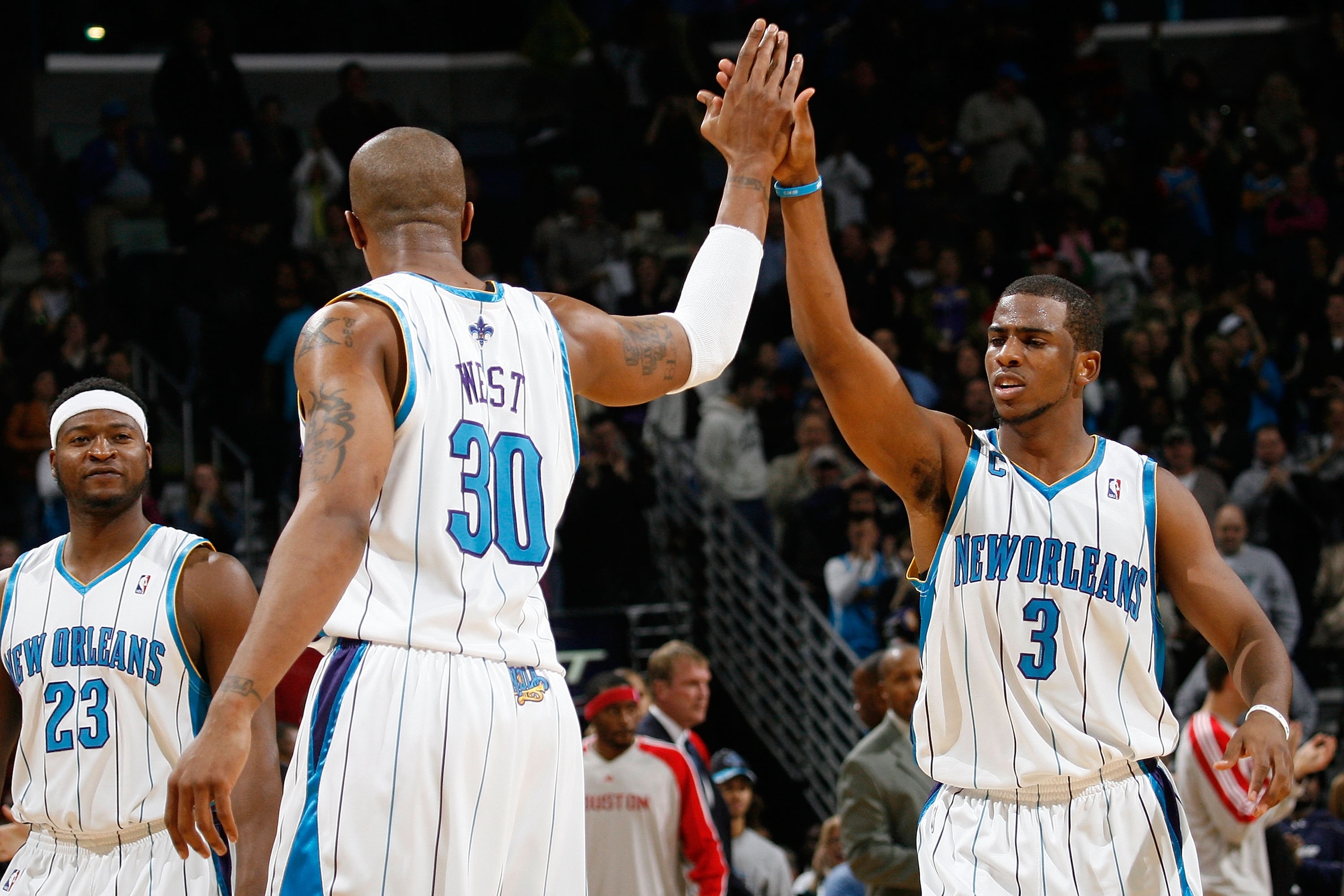 NEW ORLEANS, LA - JANUARY 02:  David West #30 and Chris Paul #3 of the New Orleans Hornets celebrate during the game against the Houston Rockets at the New Orleans Arena on January 2, 2010 in New Orleans, Louisiana.  NOTE TO USER: User expressly acknowled
