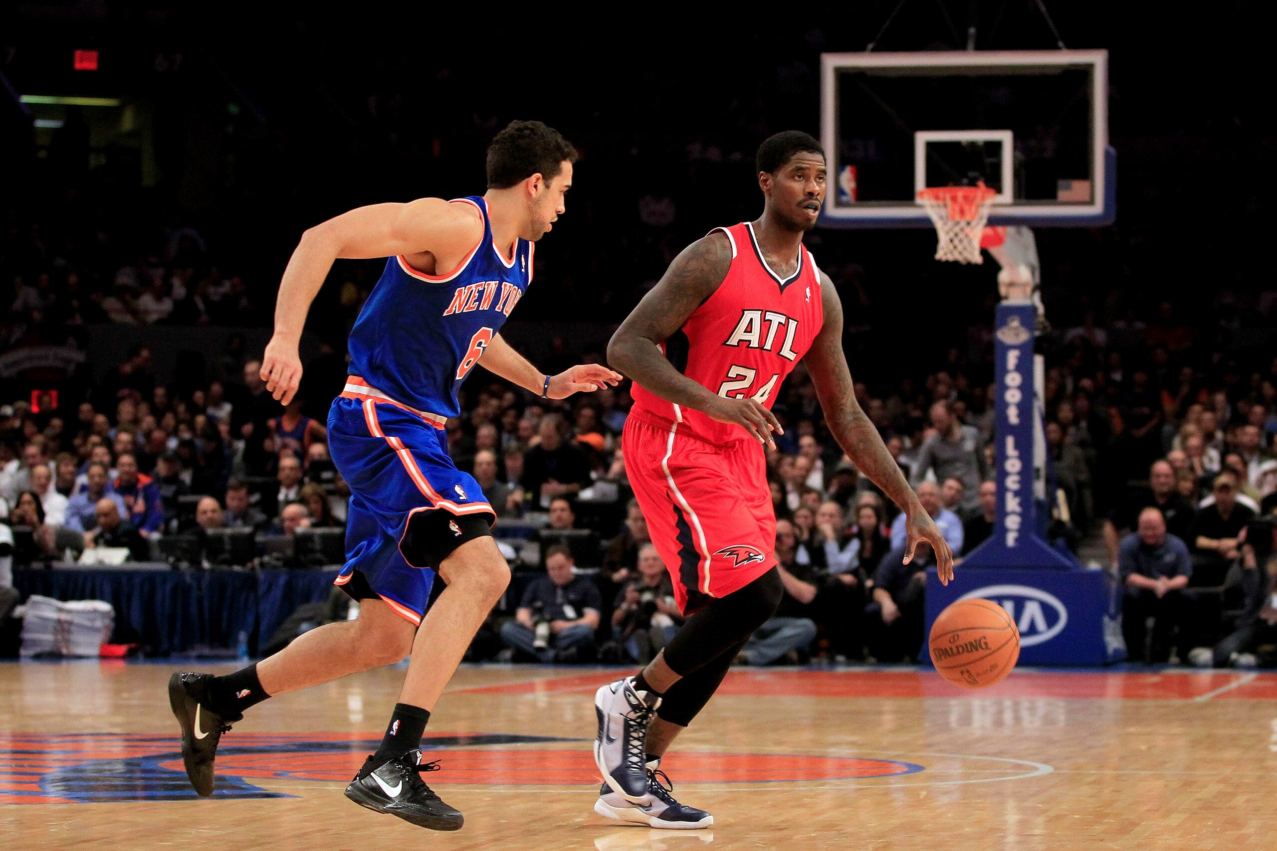 NEW YORK, NY - FEBRUARY 16:  Marvin Williams #24  of the Atlanta Hawks dribbles against Landry Fields #6 of the New York Knicks at Madison Square Garden on February 16, 2011 in New York City. NOTE TO USER: User expressly acknowledges and agrees that, by d