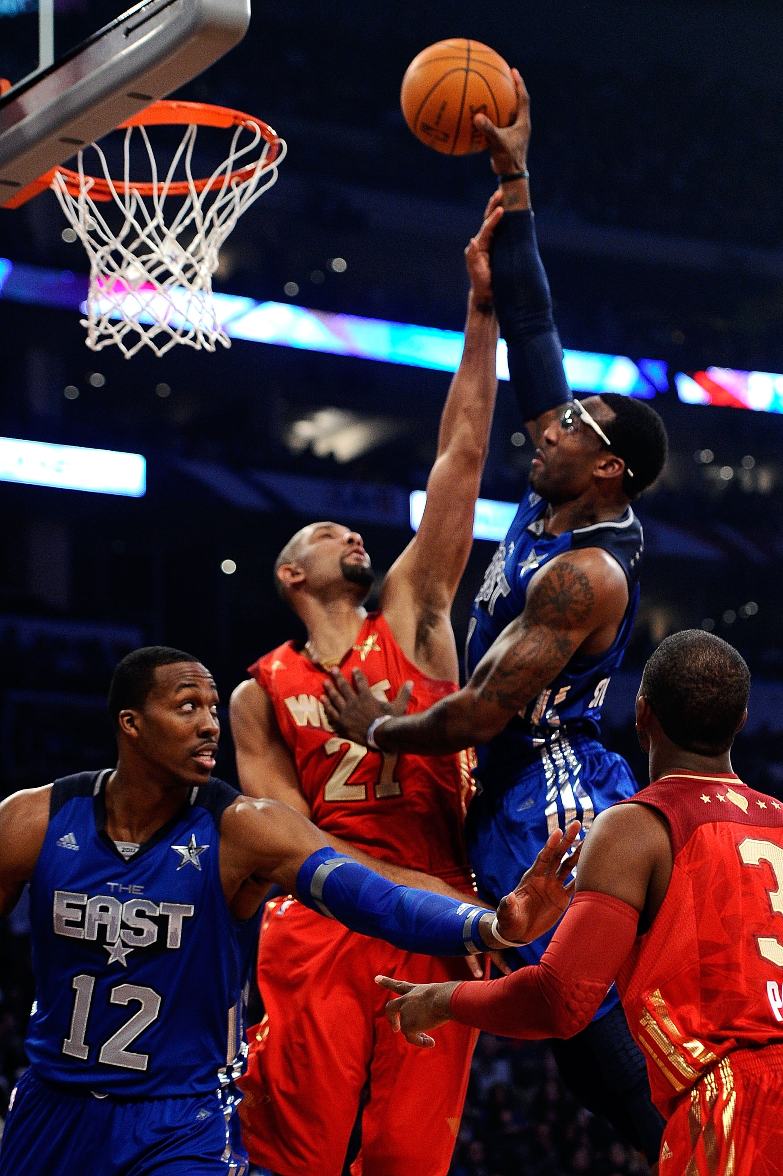 LOS ANGELES, CA - FEBRUARY 20:  Amare Stoudemire #1 of the New York Knicks and the Eastern Conference goes up for a shot over Tim Duncan #21 of the San Antonio Spurs and the Western Conference in the first quarter of the 2011 NBA All-Star Game at Staples 