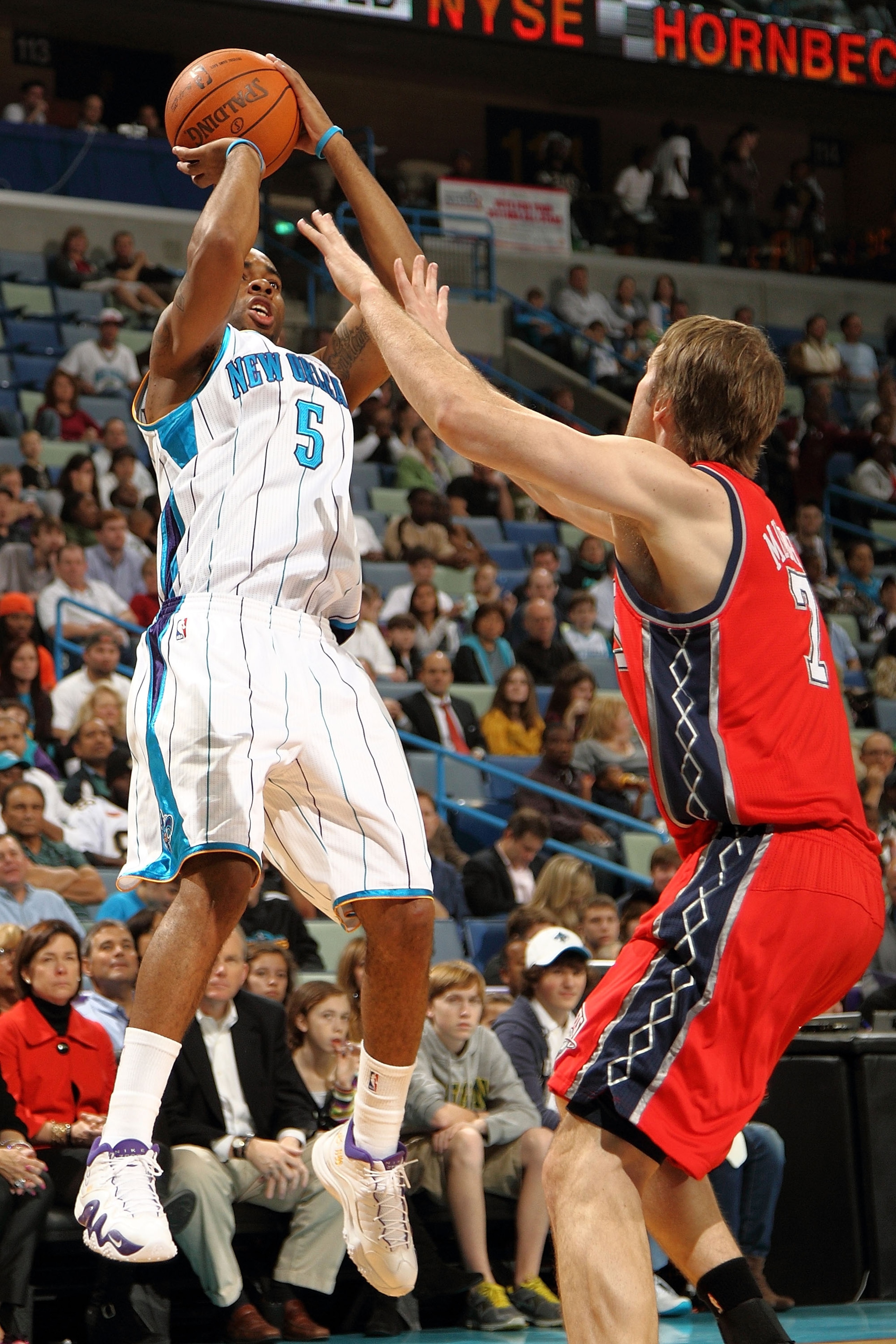NEW ORLEANS, LA - DECEMBER 22:  Marcus Thornton #5 of the New Orleans Hornets shoots the ball over Troy Murphy #7 of the New Jersey Nets at the New Orleans Arena on December 22, 2010 in New Orleans, Louisiana.  The Hornets defeated the Nets 105-91.   NOTE