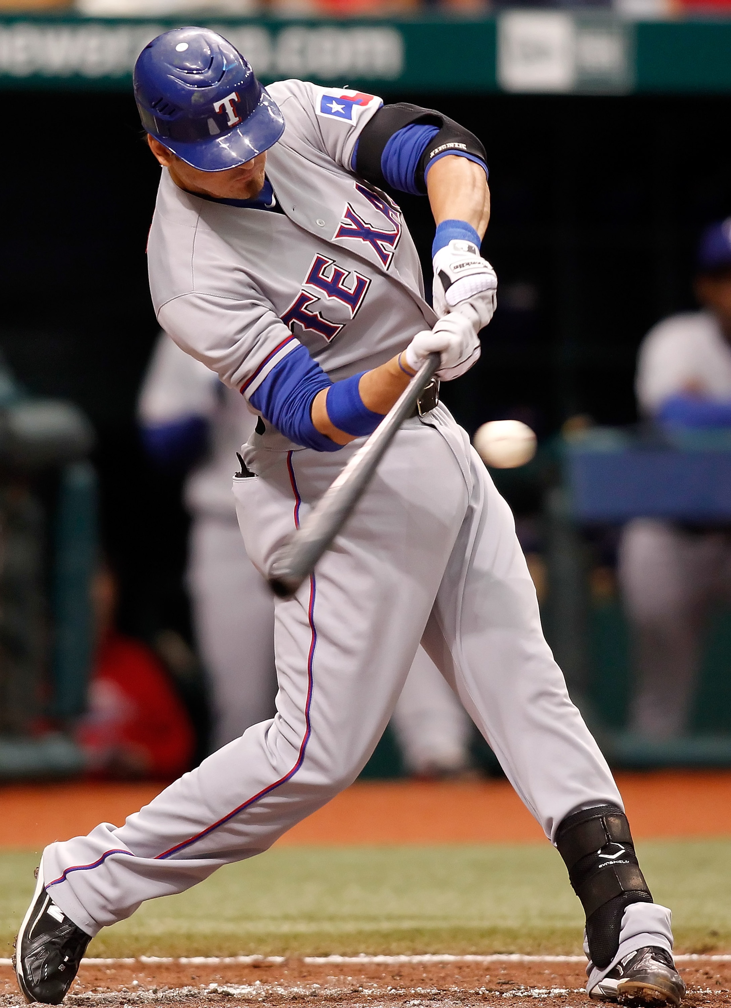 ST PETERSBURG, FL - OCTOBER 06: Infielder Jorge Cantu #8 of the Texas Rangers swings at a pitch against the Tampa Bay Rays during Game 1 of the ALDS at Tropicana Field on October 6, 2010 in St. Petersburg, Florida. (Photo by J. Meric/Getty Images)