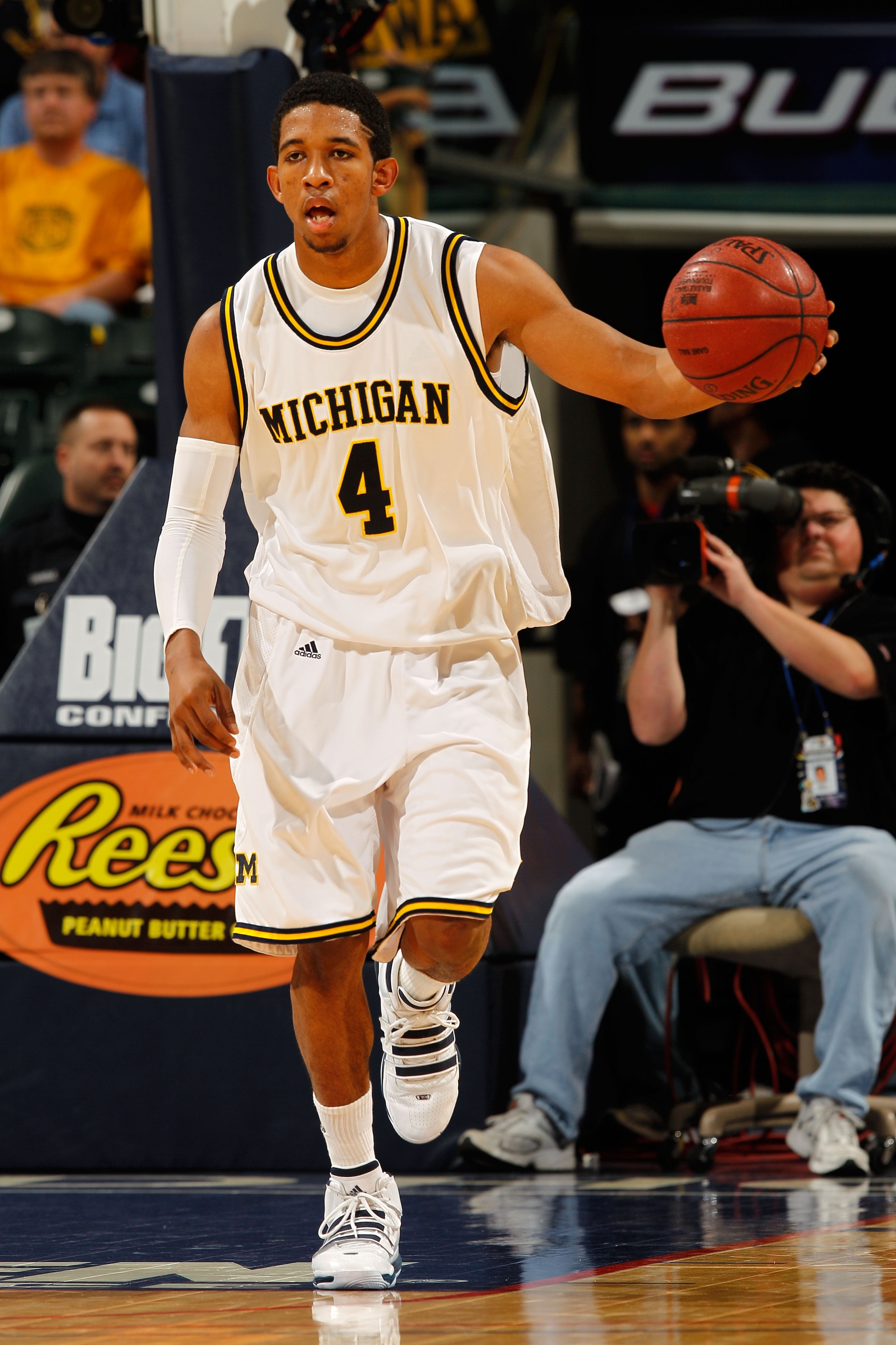 INDIANAPOLIS - MARCH 11:  Guard Darius Morris #4 of the Michigan Wolverines drives with the ball against the Iowa Hawkeyes during the first round of the Big Ten Men's Basketball Tournament at Conseco Fieldhouse on March 11, 2010 in Indianapolis, Indiana.