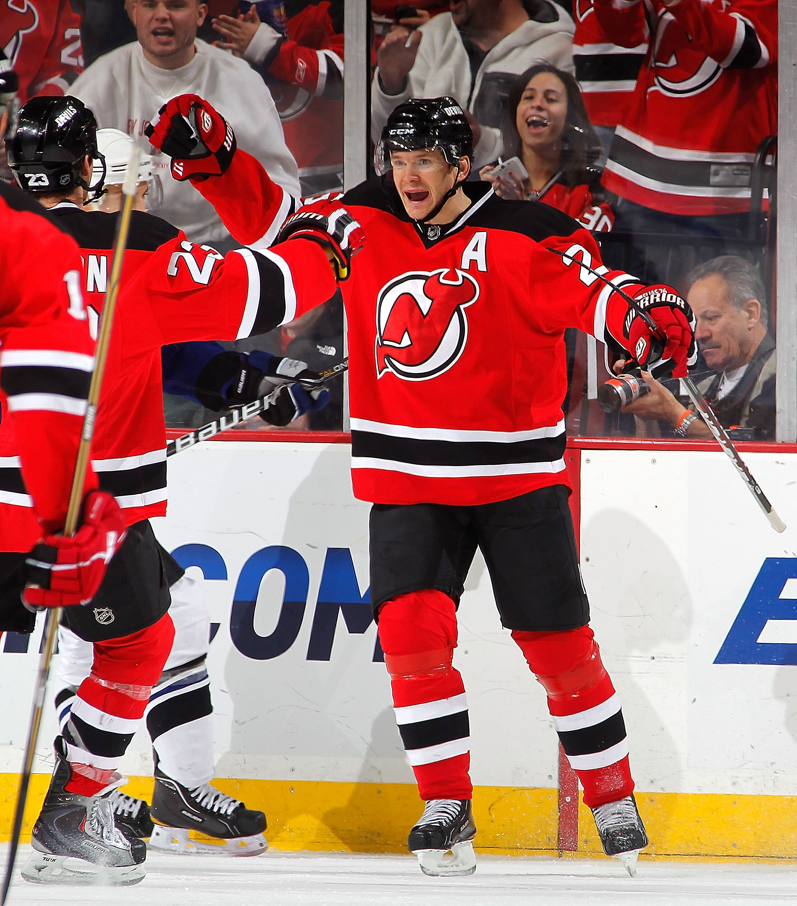 NEWARK, NJ - JANUARY 09: Patrik Elias #26 of the New Jersey Devils celebrates with teammate David Clarkson #23 after Clarkson scored a goal in the third period of an NHL hockey game at the Prudential Center on January 9, 2011 in Newark, New Jersey.  (Phot