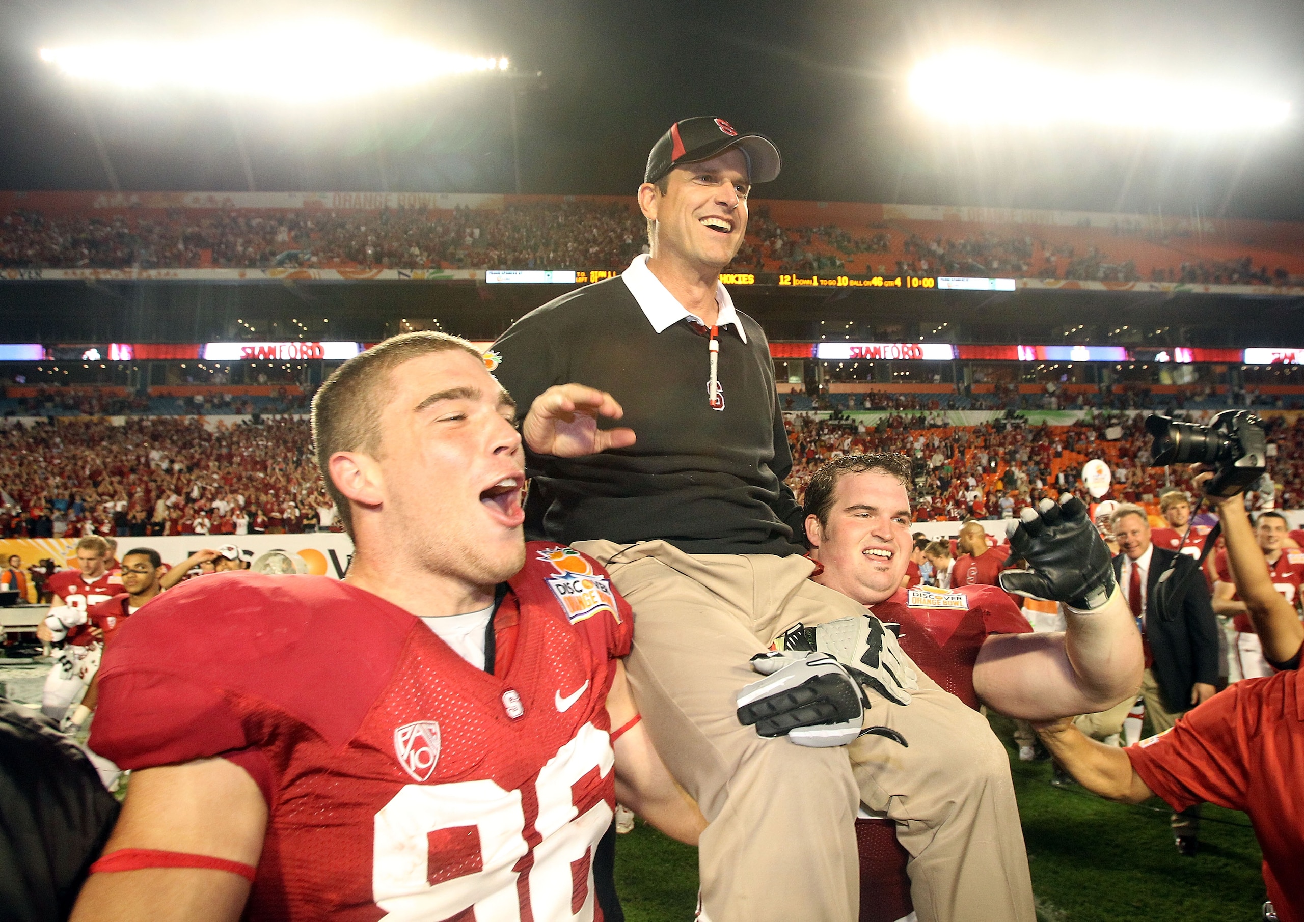 MIAMI, FL - JANUARY 03: Head coach Jim Harbaugh of the Stanford Cardinal celebrates as he is lifted up by his players including Zach Ertz #86 (L) after Stanford won 40-12 against the Virginai Tech Hokies during the 2011 Discover Orange Bowl at Sun Life S MIAMI, FL - JANUARY 03: Head coach Jim Harbaugh of the Stanford Cardinal celebrates as he is lifted up by his players including Zach Ertz #86 (L) after Stanford won 40-12 against the Virginai Tech Hokies during the 2011 Discover Orange Bowl at Sun Life S