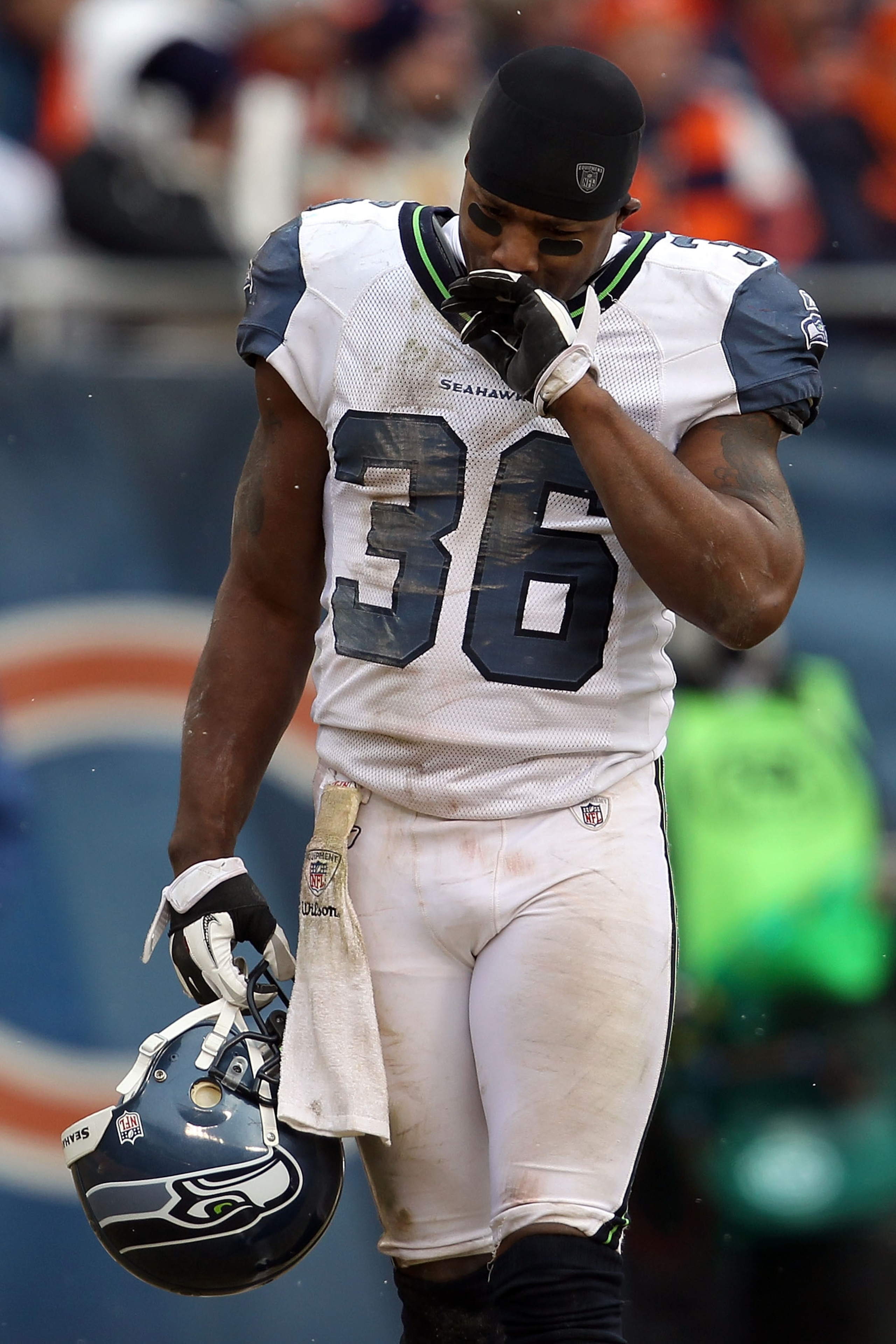 CHICAGO, IL - JANUARY 16:  Lawyer Milloy #36 of the Seattle Seahawks looks down as teammate Marcus Trufant #23 is injured on the field in the third quarter against the Chicago Bears in the 2011 NFC divisional playoff game at Soldier Field on January 16, 2