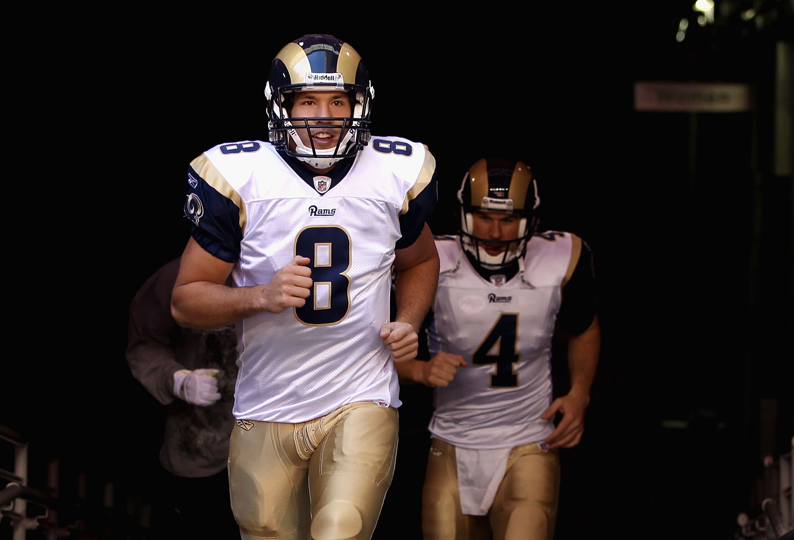 GLENDALE, AZ - DECEMBER 05:  Quarterback Sam Bradford #8 of the St. Louis Rams runs out onto the field before the NFL game against the Arizona Cardinals at the University of Phoenix Stadium on December 5, 2010 in Glendale, Arizona. The Rams defeated the C