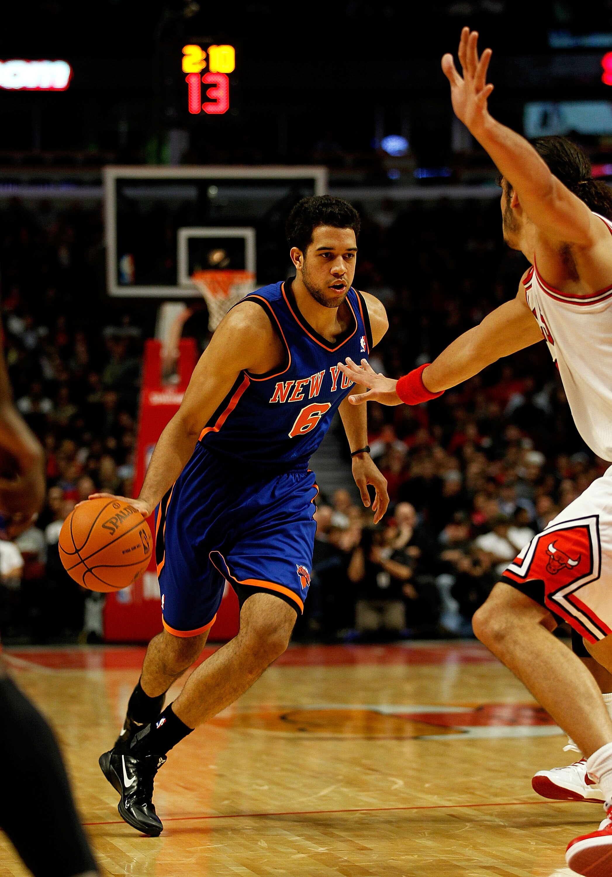 CHICAGO - NOVEMBER 04: Landry Fields #6 of the New York Knicks drives against Joakim Noah #13 of the Chicago Bulls at the United Center on November 4, 2010 in Chicago, Illinois. The Knicks defeated the Bulls 120-112. NOTE TO USER: User expressly acknowled