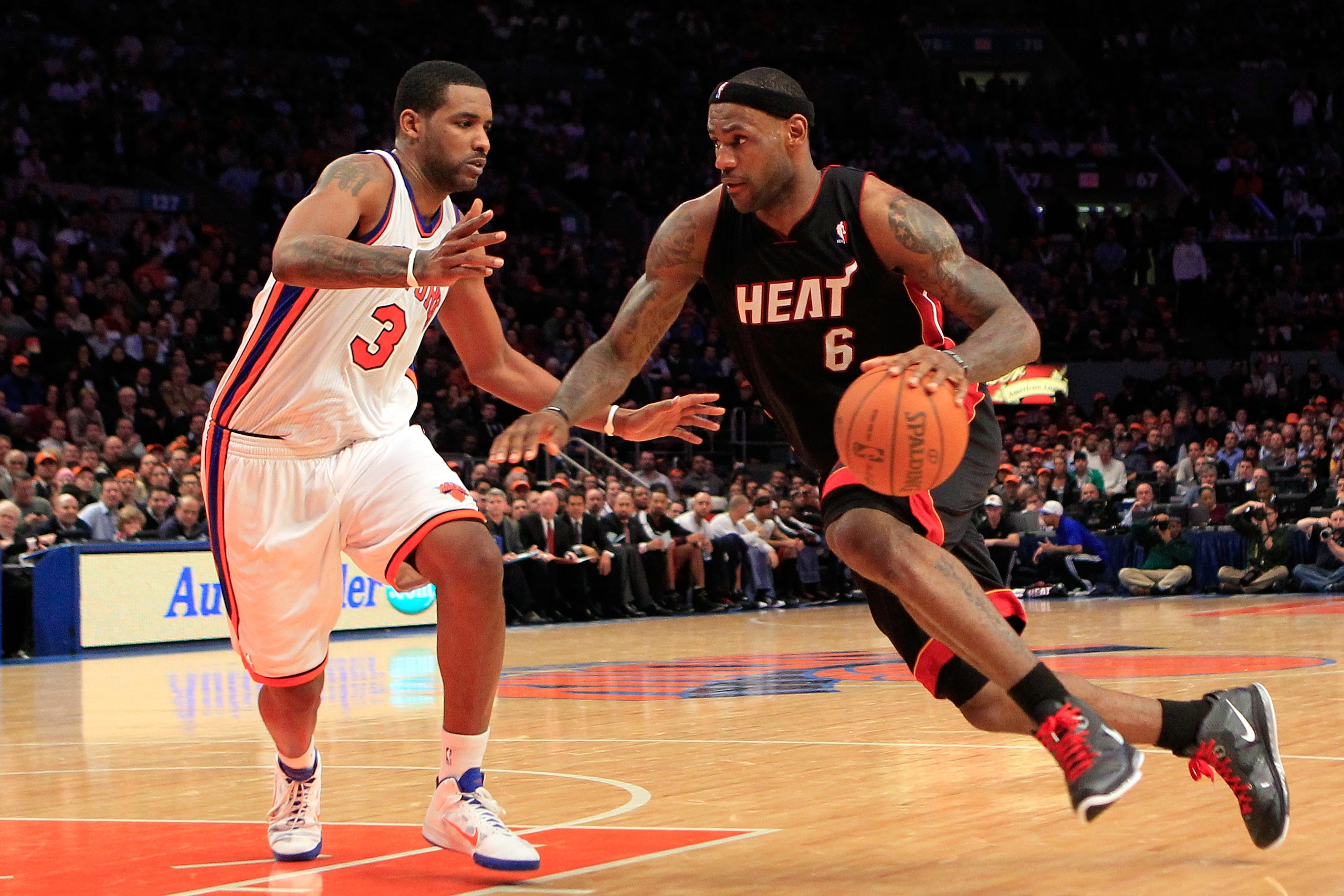 NEW YORK, NY - JANUARY 27:  LeBron James #6 of the Miami Heat drives past Shawne Williams #3 of the New York Knicks at Madison Square Garden on January 27, 2011 in New York City. The Knicks defeated the Heat 93-88. NOTE TO USER: User expressly acknowledge