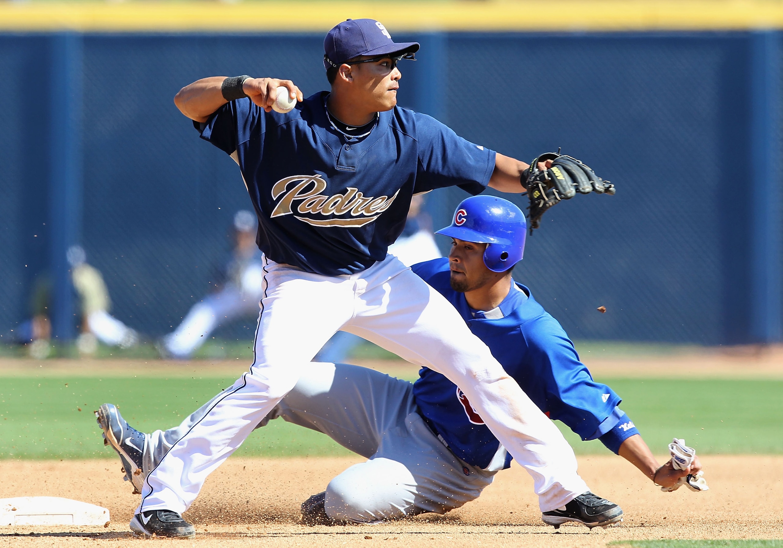 PEORIA, AZ - MARCH 11:  Infielder Everth Cabrera #1 of the San Diego Padres gets the force out on Robinson Chirinos #71 of the Chicago Cubs during the MLB spring training game at Peoria Stadium on March 11, 2010 in Peoria, Arizona.  (Photo by Christian Pe