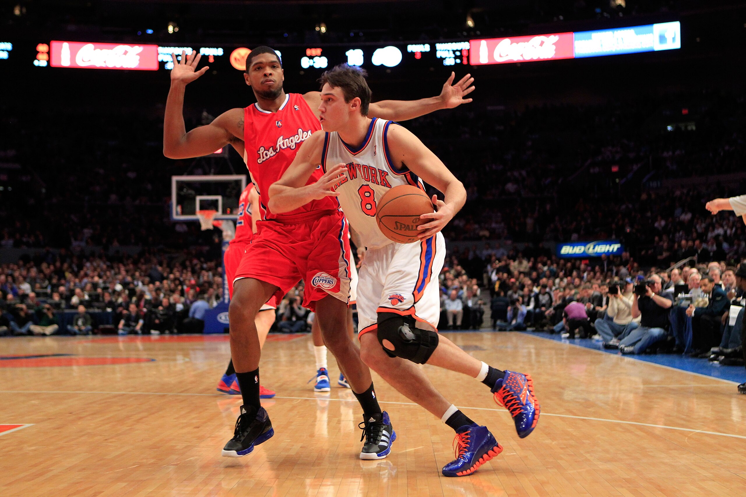 NEW YORK, NY - FEBRUARY 09:  Danilo Gallinari #8 of the New York Knicks drives against Ryan Gomes #15 of the Los Angeles Clippers at Madison Square Garden on February 9, 2011 in New York City. NOTE TO USER: User expressly acknowledges and agrees that, by