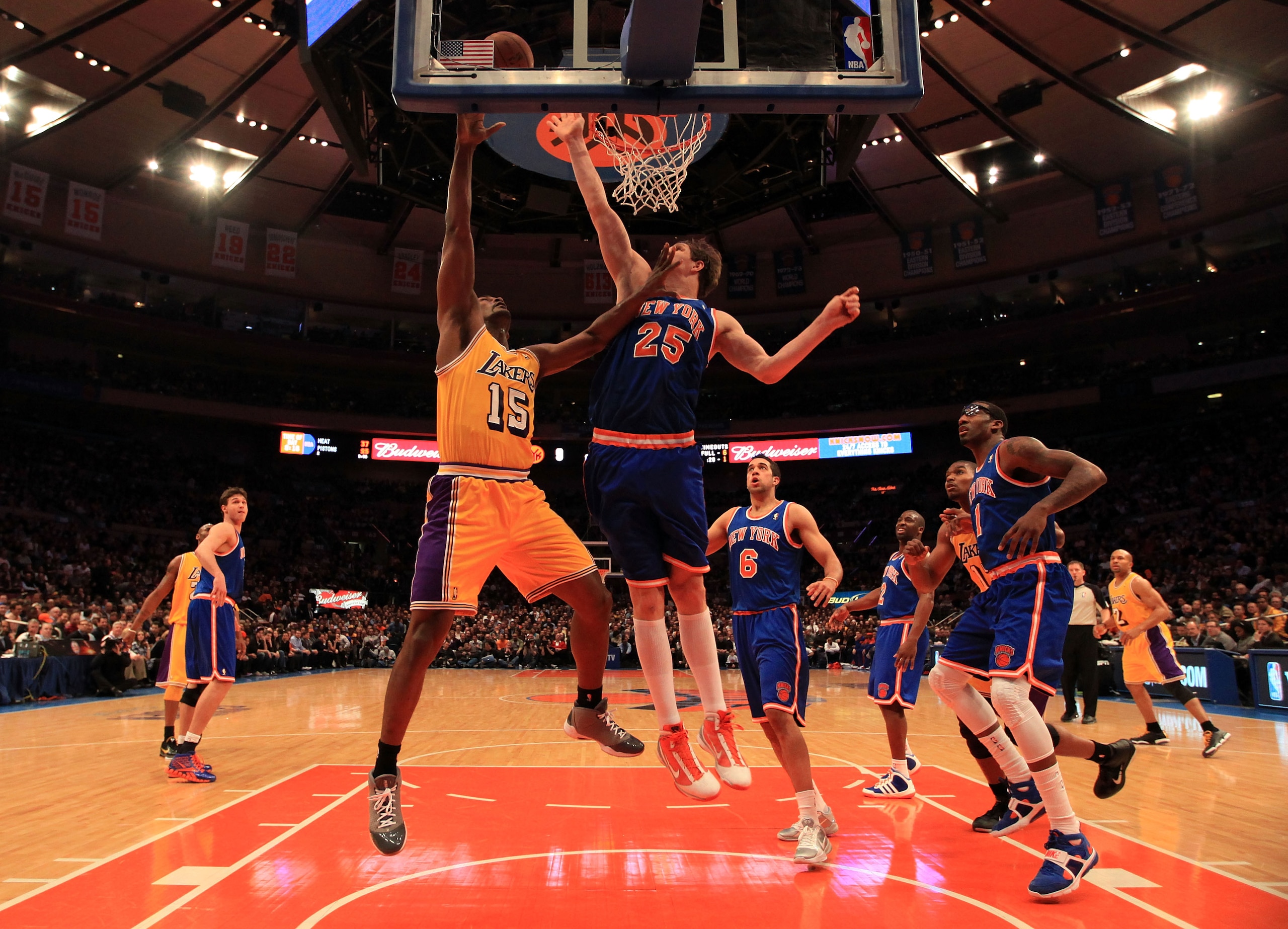 NEW YORK, NY - FEBRUARY 11:  Ron Artest #15 of the Los Angeles Lakers shoots over Timofey Mozgov #25 the New York Knicks at Madison Square Garden on February 11, 2011 in New York City. NOTE TO USER: User expressly acknowledges and agrees that, by download