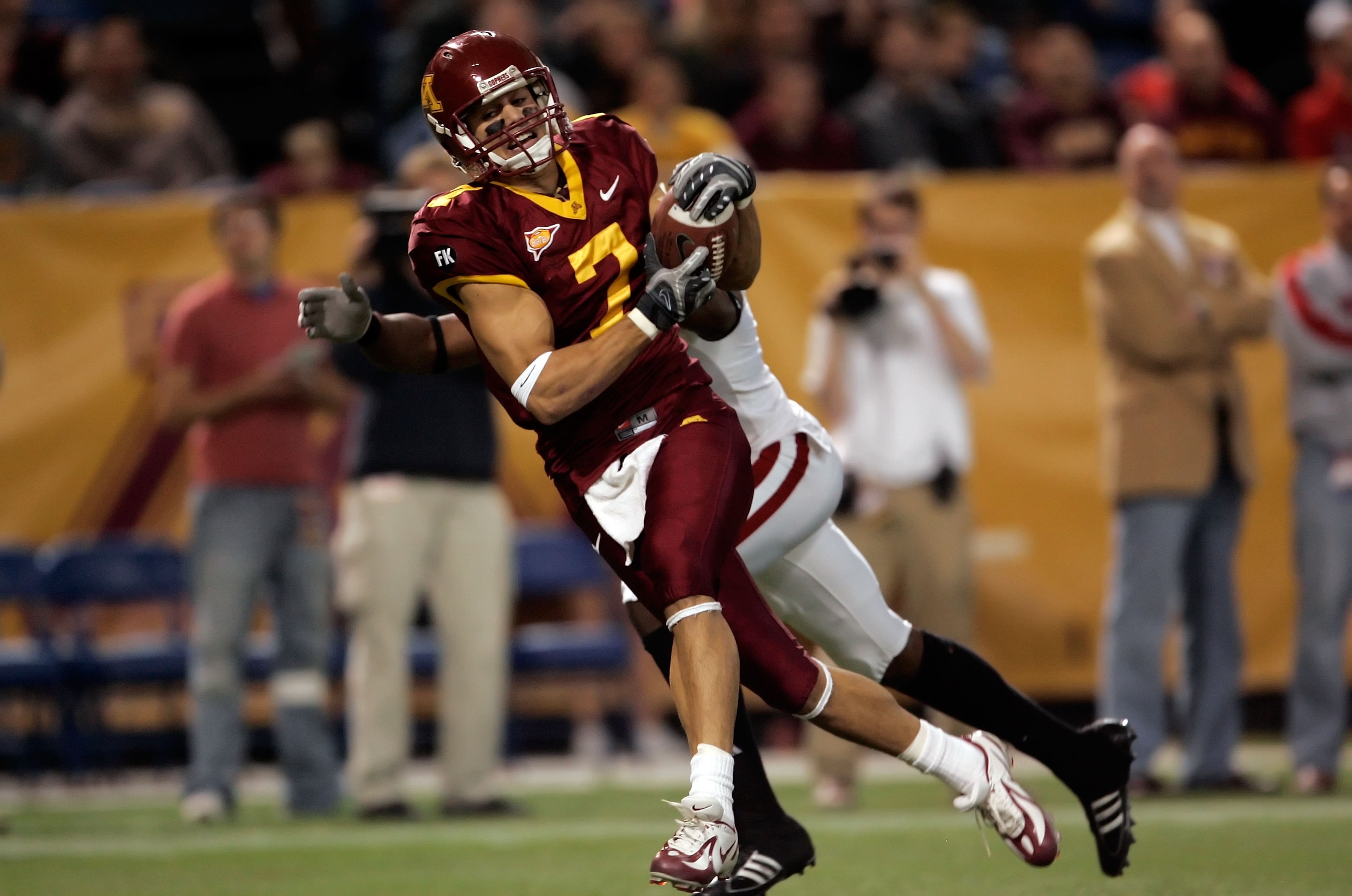 MINNEAPOLIS - NOVEMBER 17: Wide receiver Eric Decker #7 of the Minnesota Golden Gophers catches a pass for a touchdown while being defended by Jack Ikegwuonu #6 of the Wisconsin Badgers in the second quarter at the Hubert H. Humphrey Metrodome November 1 MINNEAPOLIS - NOVEMBER 17: Wide receiver Eric Decker #7 of the Minnesota Golden Gophers catches a pass for a touchdown while being defended by Jack Ikegwuonu #6 of the Wisconsin Badgers in the second quarter at the Hubert H. Humphrey Metrodome November 1