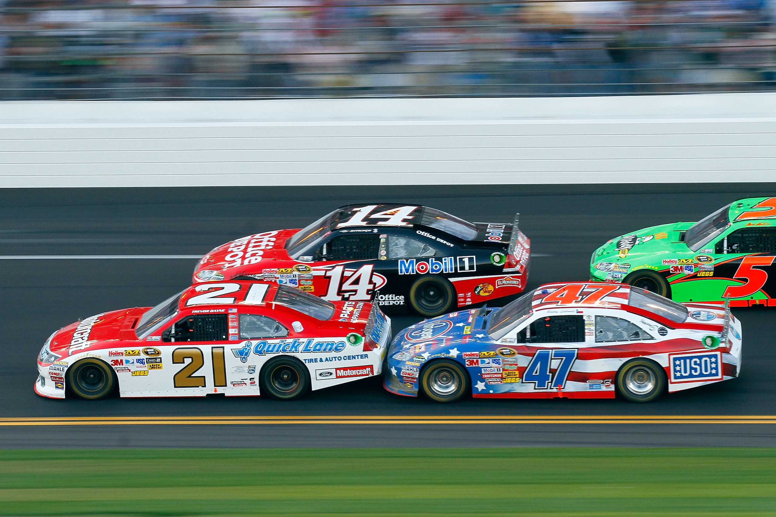 DAYTONA BEACH, FL - FEBRUARY 20: Trevor Bayne, driver of the #21 Motorcraft/Quick Lane Ford, Tony Stewart, driver of the #14 Mobil 1/Office Depot Chevrolet, and Bobby Labonte, driver of the #47 Kroger/USO Toyota, race during the NASCAR Sprint Cup Series DAYTONA BEACH, FL - FEBRUARY 20: Trevor Bayne, driver of the #21 Motorcraft/Quick Lane Ford, Tony Stewart, driver of the #14 Mobil 1/Office Depot Chevrolet, and Bobby Labonte, driver of the #47 Kroger/USO Toyota, race during the NASCAR Sprint Cup Series