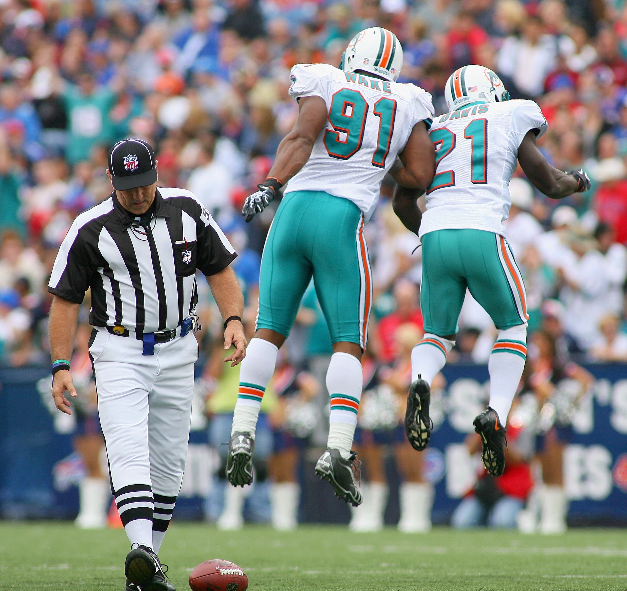 ORCHARD PARK, NY - SEPTEMBER 12: Cameron Wake #91 and Vontae Davis #21 of the Miami Dolphins celebrate a sack against the Buffalo Bills  during the NFL season opener at Ralph Wilson Stadium on September 12, 2010 in Orchard Park, New York.  Miami won 15-10