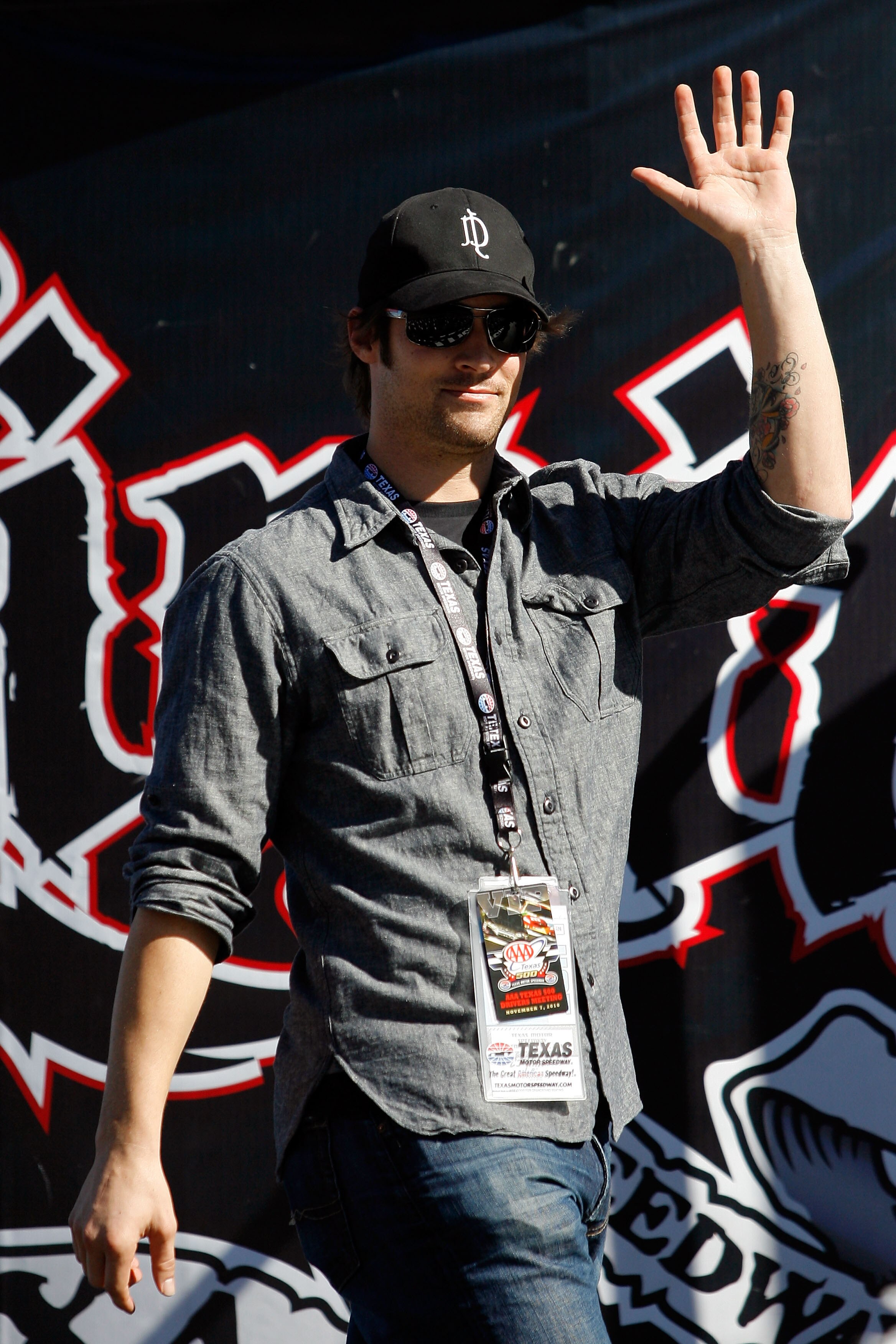 FORT WORTH, TX - NOVEMBER 07:  Texas Rangers starting pitcher and Official Pace Car Driver C.J. Wilson takes part in pre-race ceremonies prior to the NASCAR Sprint Cup Series AAA Texas 500 at Texas Motor Speedway on November 7, 2010 in Fort Worth, Texas.