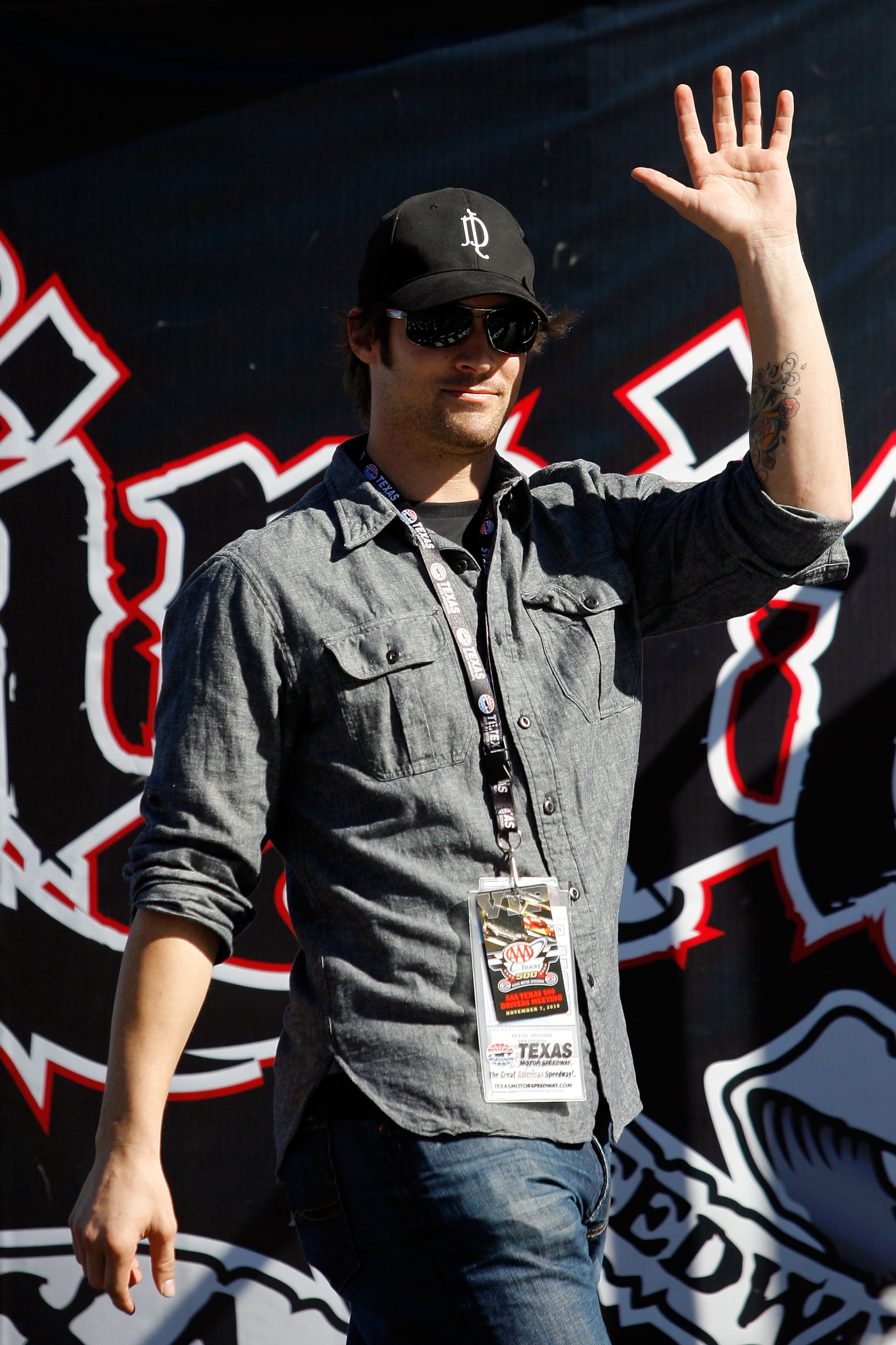 FORT WORTH, TX - NOVEMBER 07:  Texas Rangers starting pitcher and Official Pace Car Driver C.J. Wilson takes part in pre-race ceremonies prior to the NASCAR Sprint Cup Series AAA Texas 500 at Texas Motor Speedway on November 7, 2010 in Fort Worth, Texas.