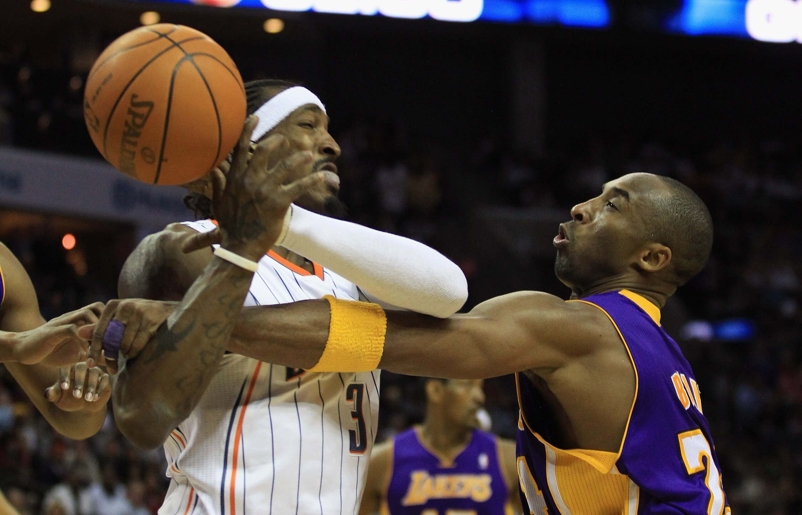CHARLOTTE, NC - FEBRUARY 14: Kobe Bryant #24 of the Los Angeles Lakers knocks the ball away from Gerald Wallce #3 of the Charlotte Bobcats during their game at Time Warner Cable Arena on February 14, 2011 in Charlotte, North Carolina. NOTE TO USER: User CHARLOTTE, NC - FEBRUARY 14: Kobe Bryant #24 of the Los Angeles Lakers knocks the ball away from Gerald Wallce #3 of the Charlotte Bobcats during their game at Time Warner Cable Arena on February 14, 2011 in Charlotte, North Carolina. NOTE TO USER: User