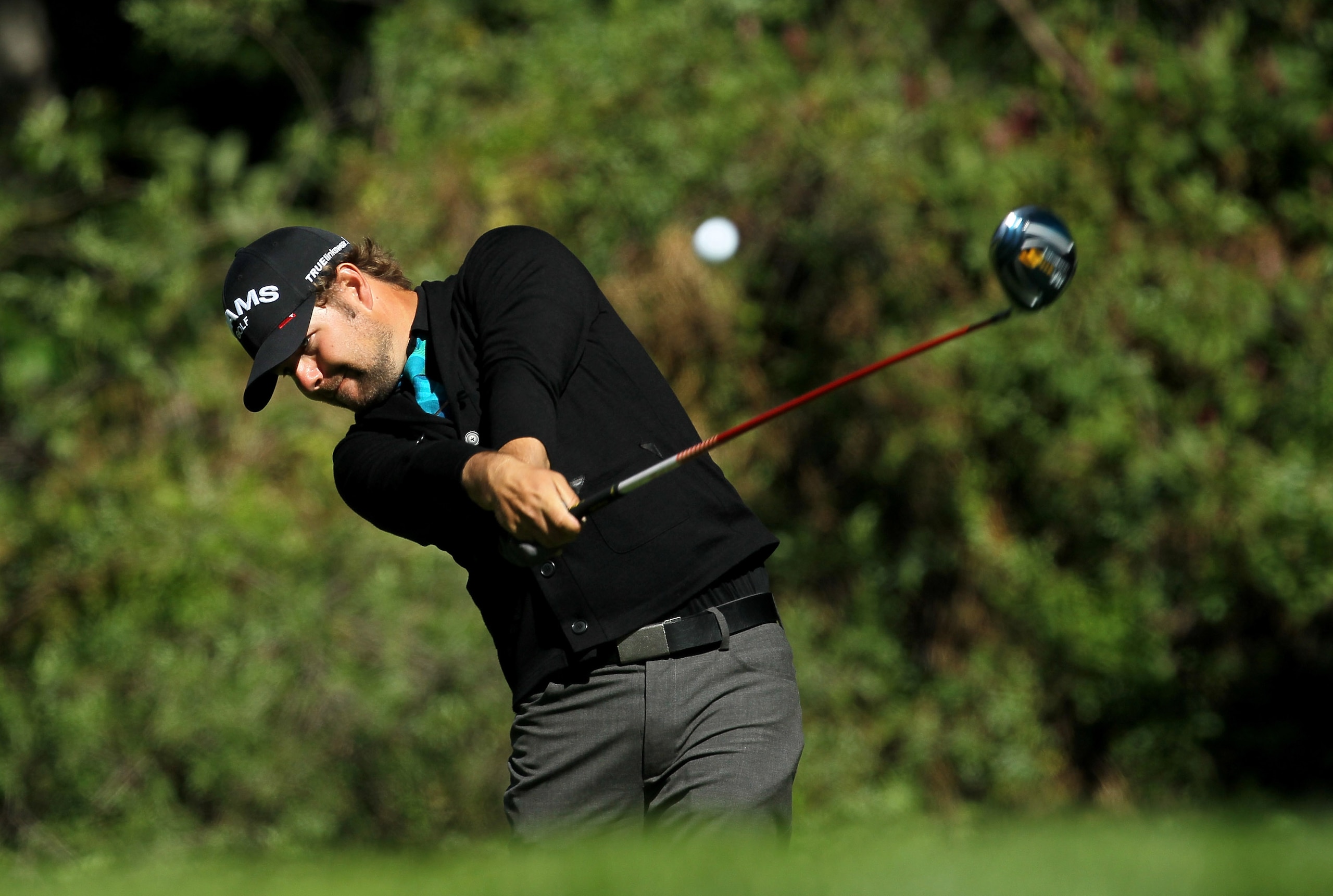 PACIFIC PALISADES, CA - FEBRUARY 20: Ryan Moore hits his tee shot on the 12th hole during the final round of the Northern Trust Open at Riviera Country Club on February 20, 2011 in Pacific Palisades, California. Couples double bogeyed the hole. (Photo b PACIFIC PALISADES, CA - FEBRUARY 20: Ryan Moore hits his tee shot on the 12th hole during the final round of the Northern Trust Open at Riviera Country Club on February 20, 2011 in Pacific Palisades, California. Couples double bogeyed the hole. (Photo b