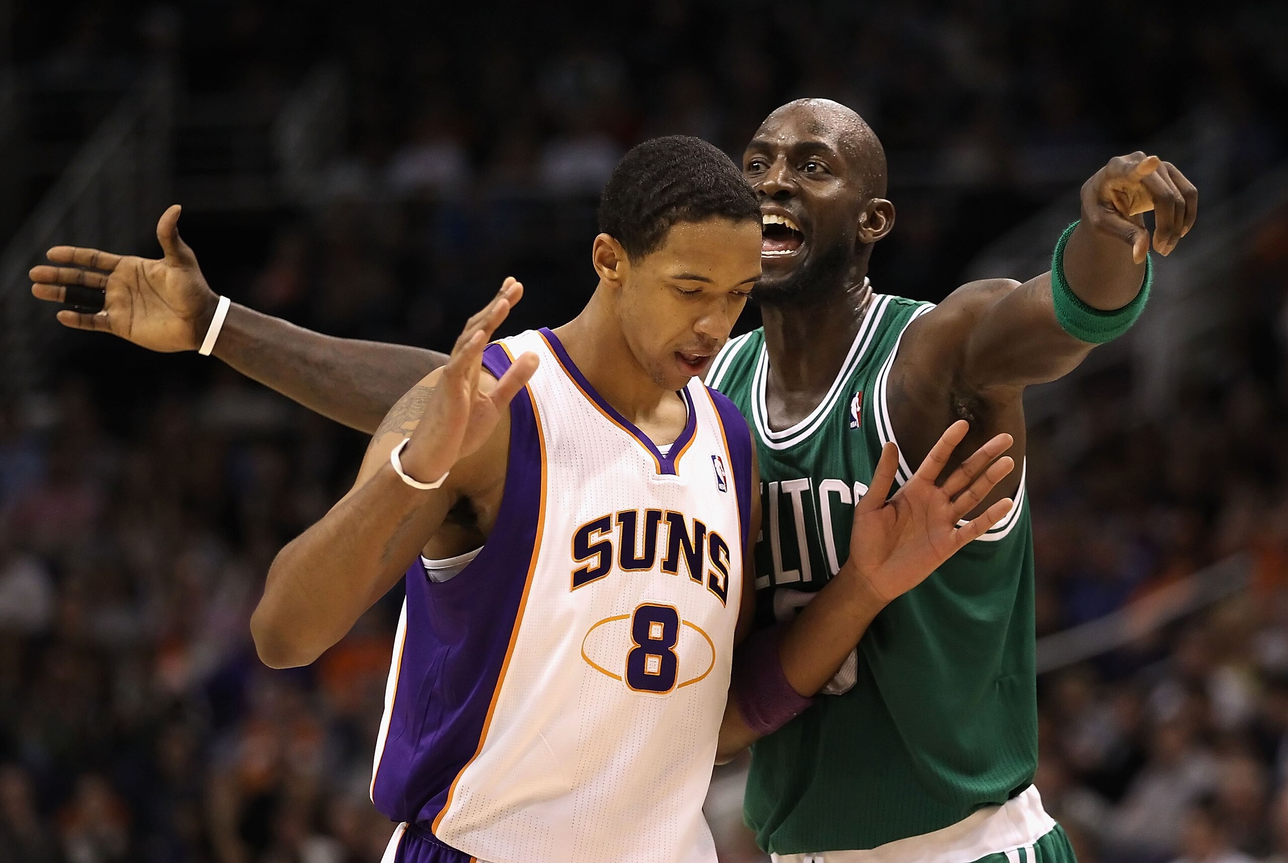 PHOENIX, AZ - JANUARY 28: Kevin Garnett #5 of the Boston Celtics reacts to Channing Frye #8 of the Phoenix Suns during the NBA game at US Airways Center on January 28, 2011 in Phoenix, Arizona. The Suns defeated the Celtics 88-71. NOTE TO USER: User exp PHOENIX, AZ - JANUARY 28: Kevin Garnett #5 of the Boston Celtics reacts to Channing Frye #8 of the Phoenix Suns during the NBA game at US Airways Center on January 28, 2011 in Phoenix, Arizona. The Suns defeated the Celtics 88-71. NOTE TO USER: User exp
